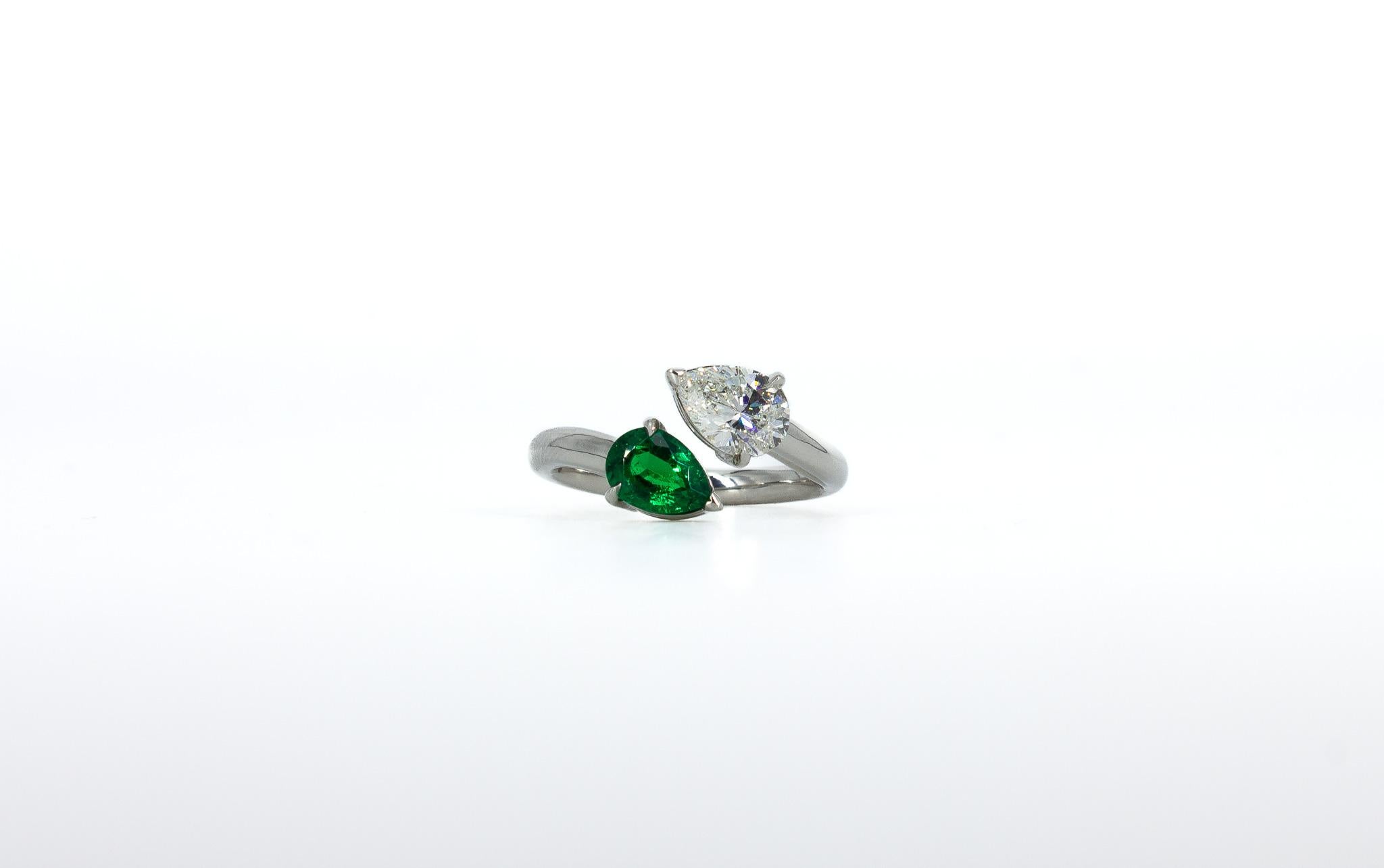 Enhance your style with this masterfully crafted J. Birnbach Toi et Moi Diamond and Emerald Ring. The two stunning, contrasting stones come together in perfect union. Set in a luxurious platinum mount, this elegant ring features a 0.90 carat GIA