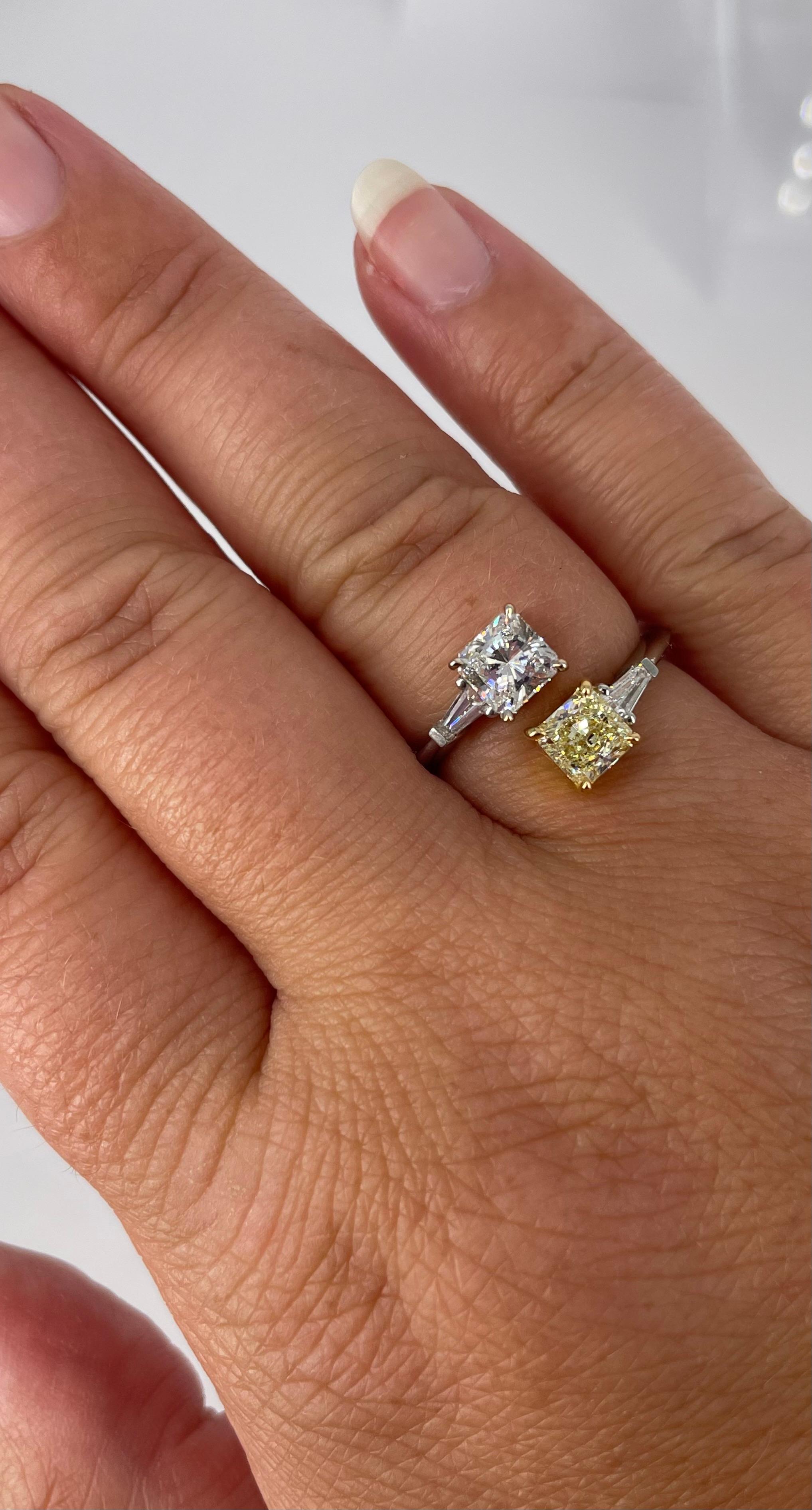 An elegant and unique take on the two stone ring trend! This stunning Toi et Moi ring complements any finger, and could also work as a one of a kind engagement ring. This piece features a 0.61 carat white radiant cut diamond, certified by GIA to be
