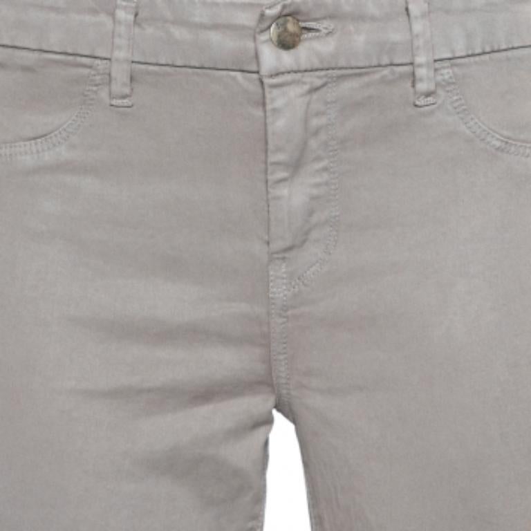J Brand's Anja pants made of quality materials feature button-zip closure, belt posts on the waistband, and ankle cuffs. Dress it up with a sleeveless stop, loose-fit blazer and high heels, or a T-shirt and sneakers.