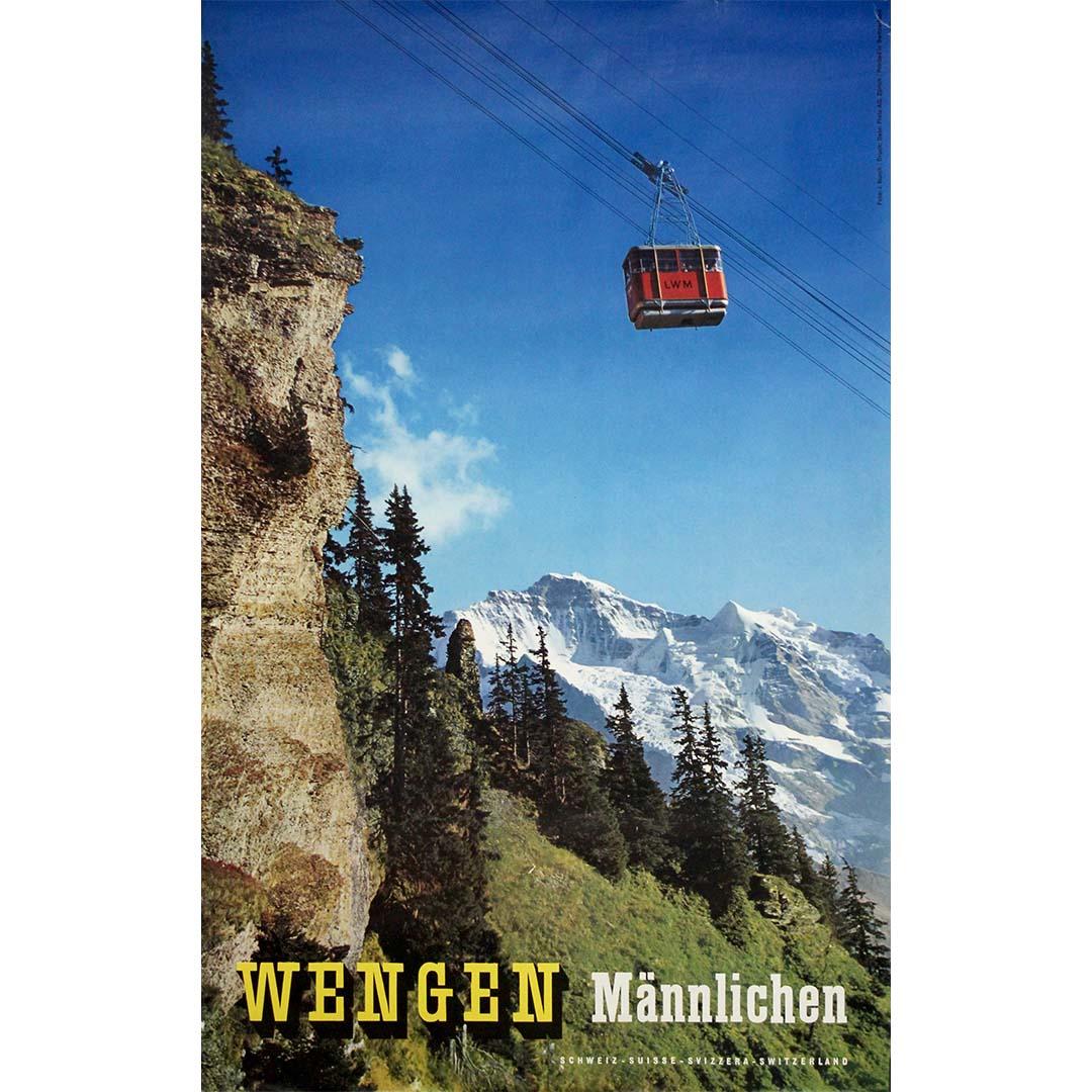 This stunning 1958 original travel poster by J. Burch captures the exhilarating ascent from Wengen to the Männlichen in the heart of the Bernese Oberland, one of Switzerland’s most majestic alpine regions. Issued to promote travel to the Jungfrau