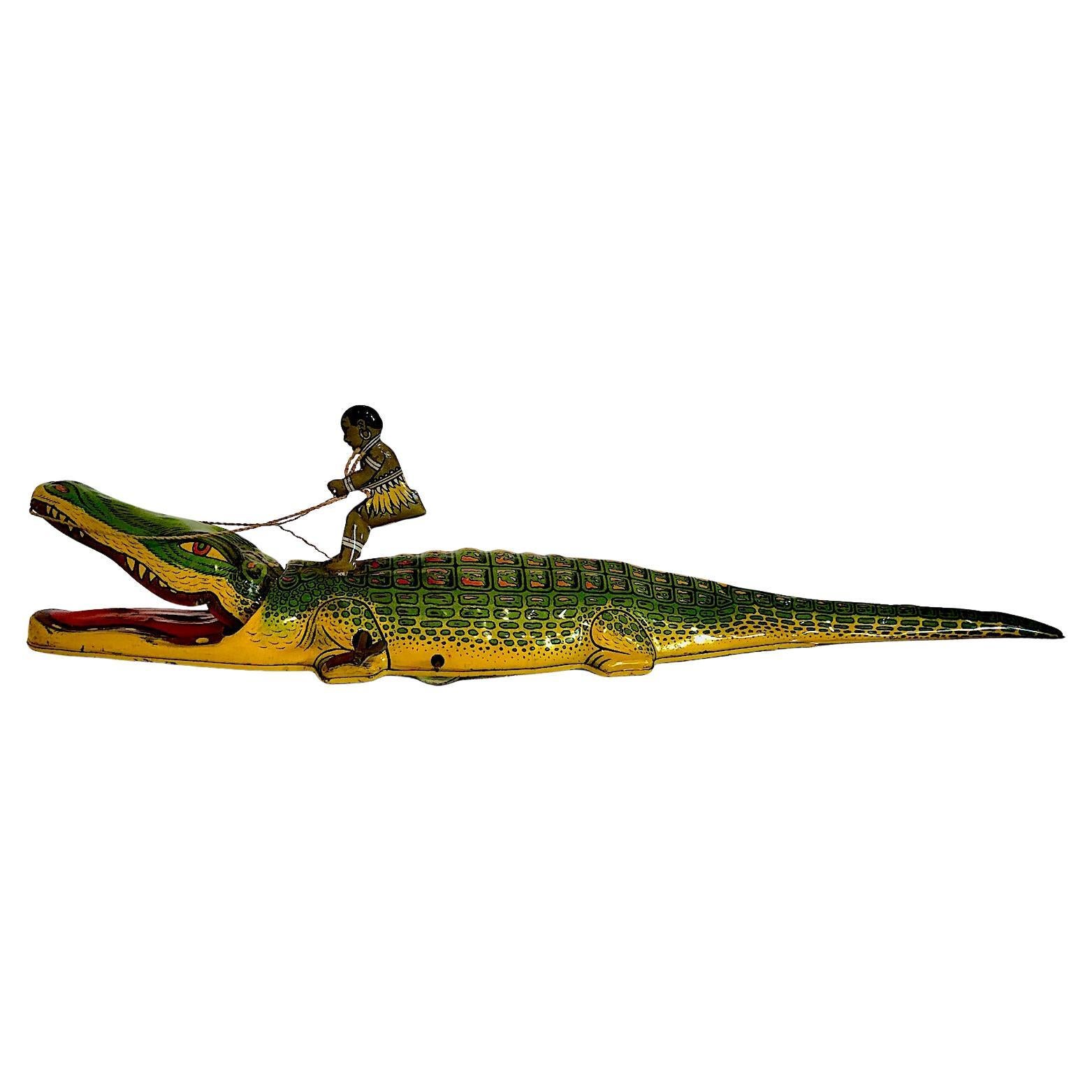J. Chein & Company 1930s Wind-up Toy of a Boy Riding an Alligator in vendita