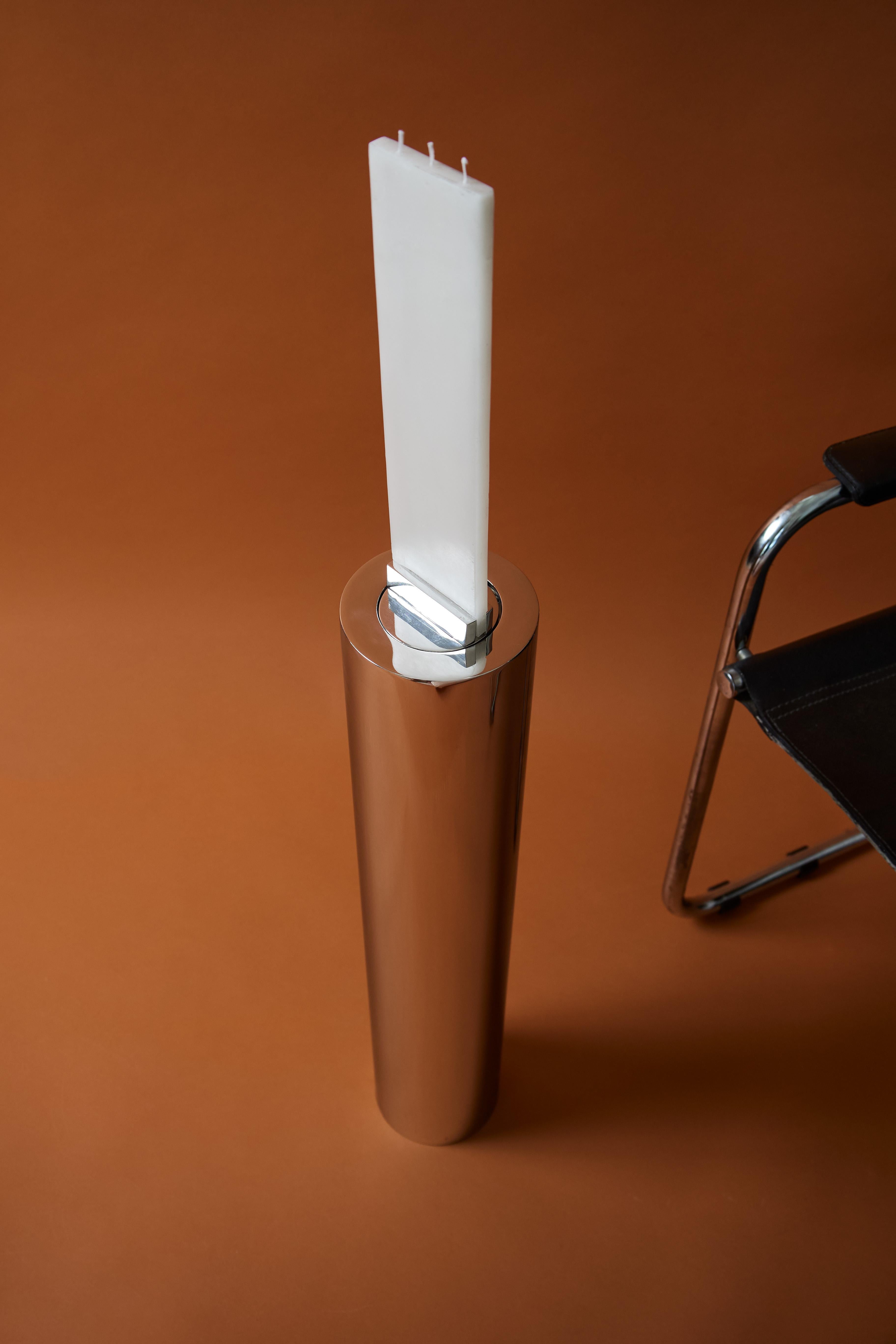J D Candle Holder Stainless Steel by Nish Studio
Dimensions: D13 x H 70 cm 
Materials: polish stainless steel

N I S H is a Cape Town based Fashion and Furniture design studio. N I S H creates contemporary, elegant and progressive designs that