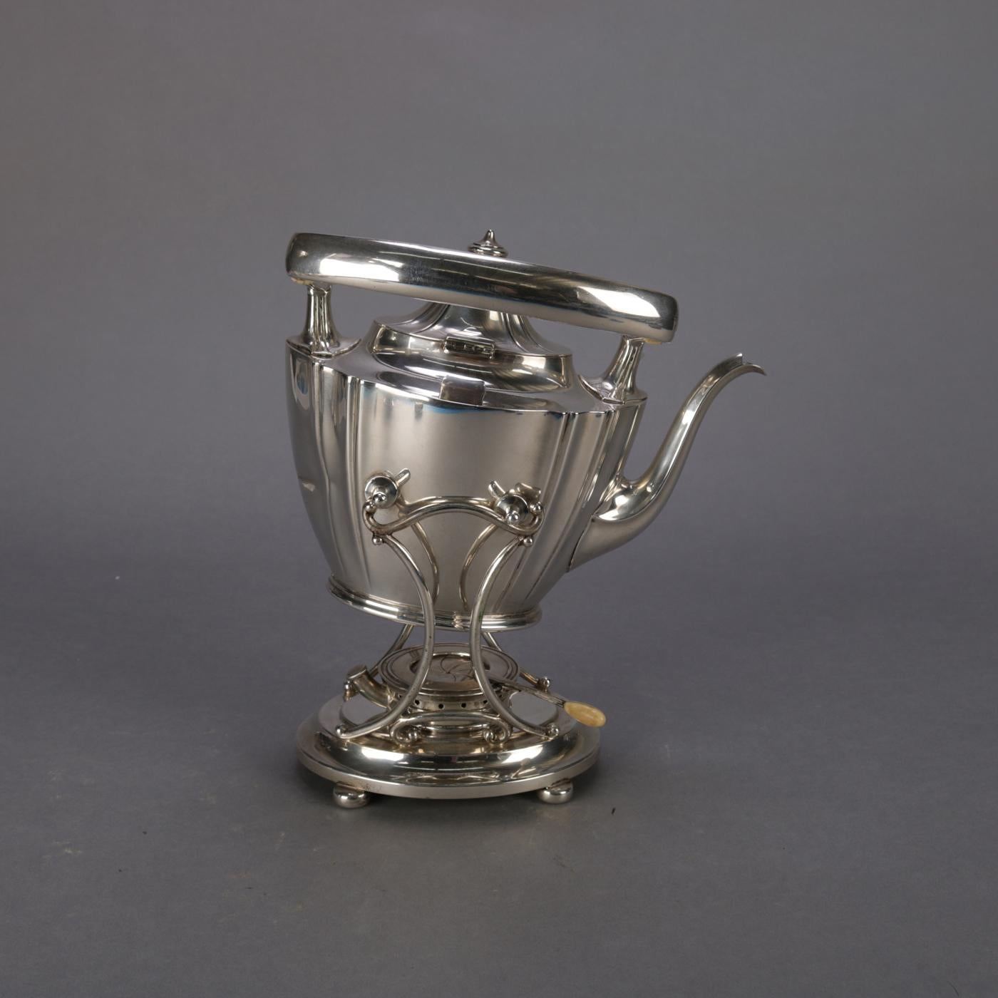 Sterling silver teapot by J.E. Caldwell & Co. feature tapered vessel with swivel handle and seated on footed warming Stand with burner, maker marks on base as photographed, total weight 44.12 toz (27.89 toz teapot only), 20th century

***DELIVERY