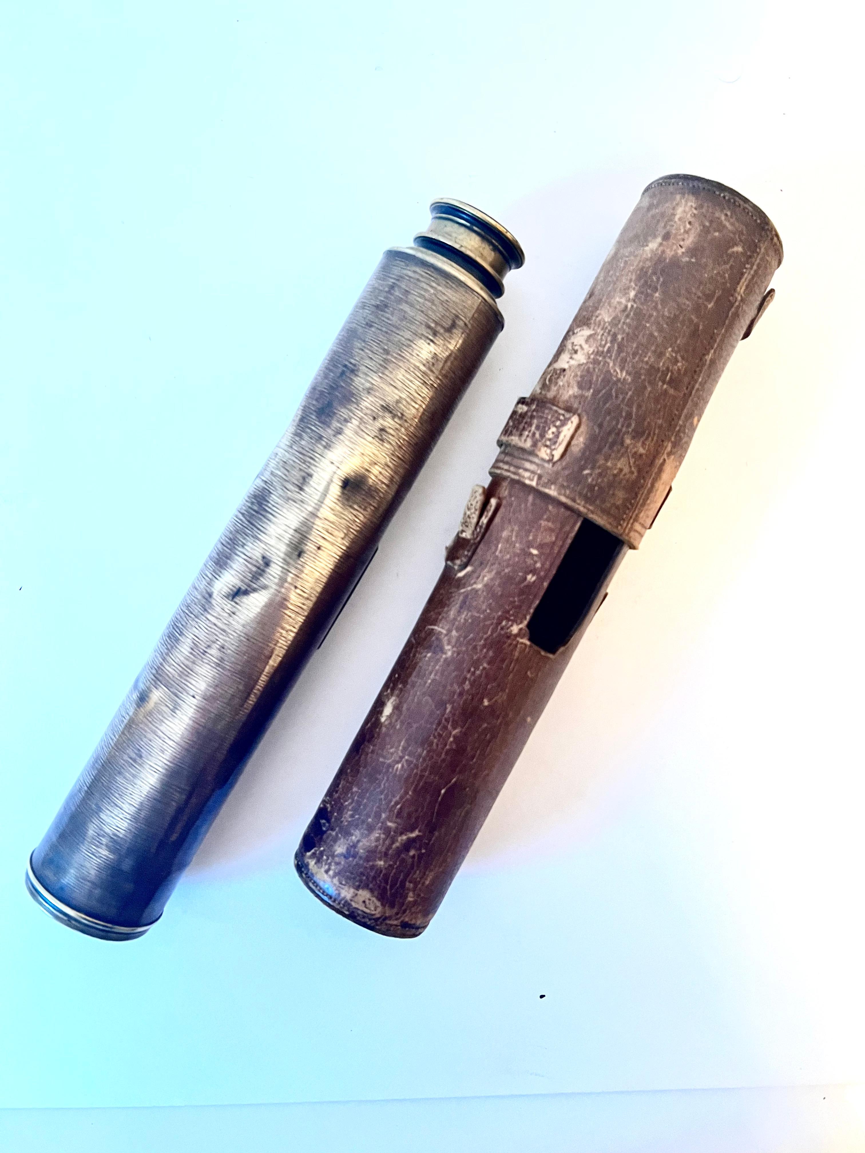 J H Steward Brass Telescope.  The Lord Bury Telescope comes with a leather case.  The brass and leather both. are very patinated.   Not only is the brass tarnished, but there are a few dings and some scratches, however it is still quite functional. 