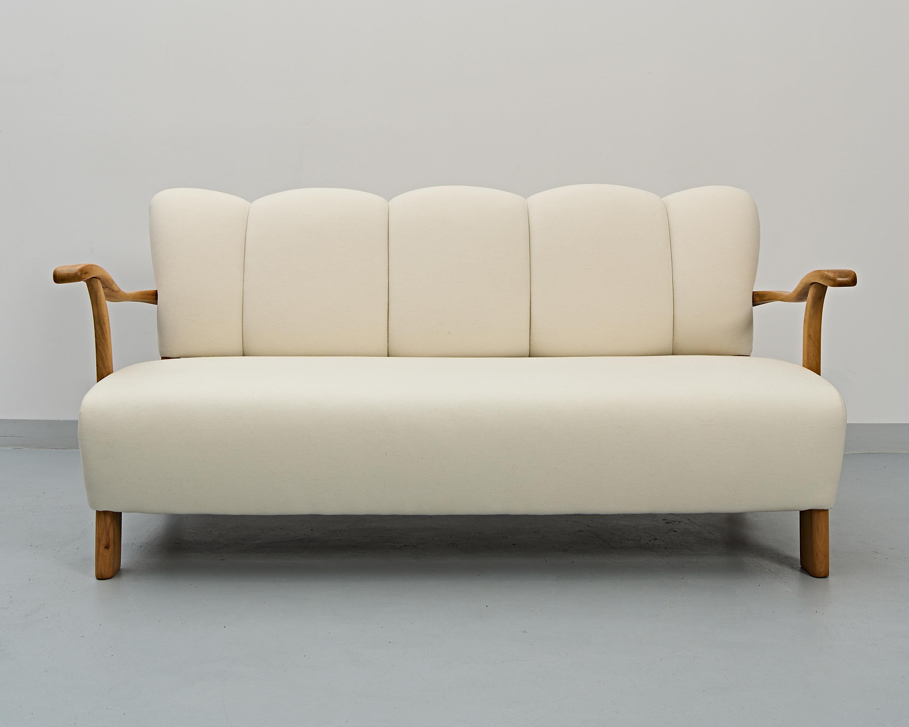 An art deco set of a sofa with two armchairs by the world renowned former Czechoslovakian designer - Jindrich Halabala. 
Incredible restoration work. 
A strikingly beautiful set of vintage furniture and an impressive investment.