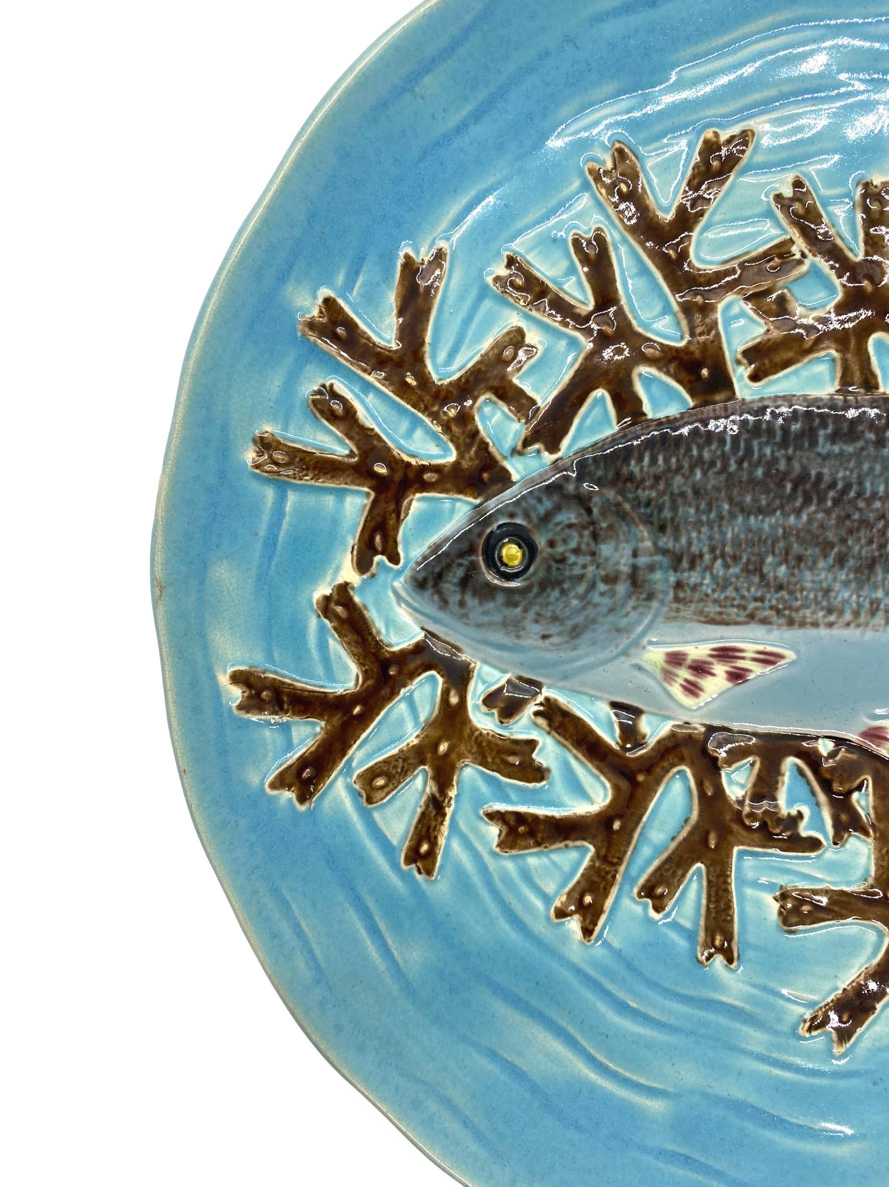 Joseph Holdcroft Majolica Trompe L'oeil Salmon Plate, naturalistically molded with a life-like salmon on a bed of red seaweed, on a relief molded basket-weave turquoise ground; the reverse with impressed mark,
'J HOLDCROFT.' 
For 30 years, we have
