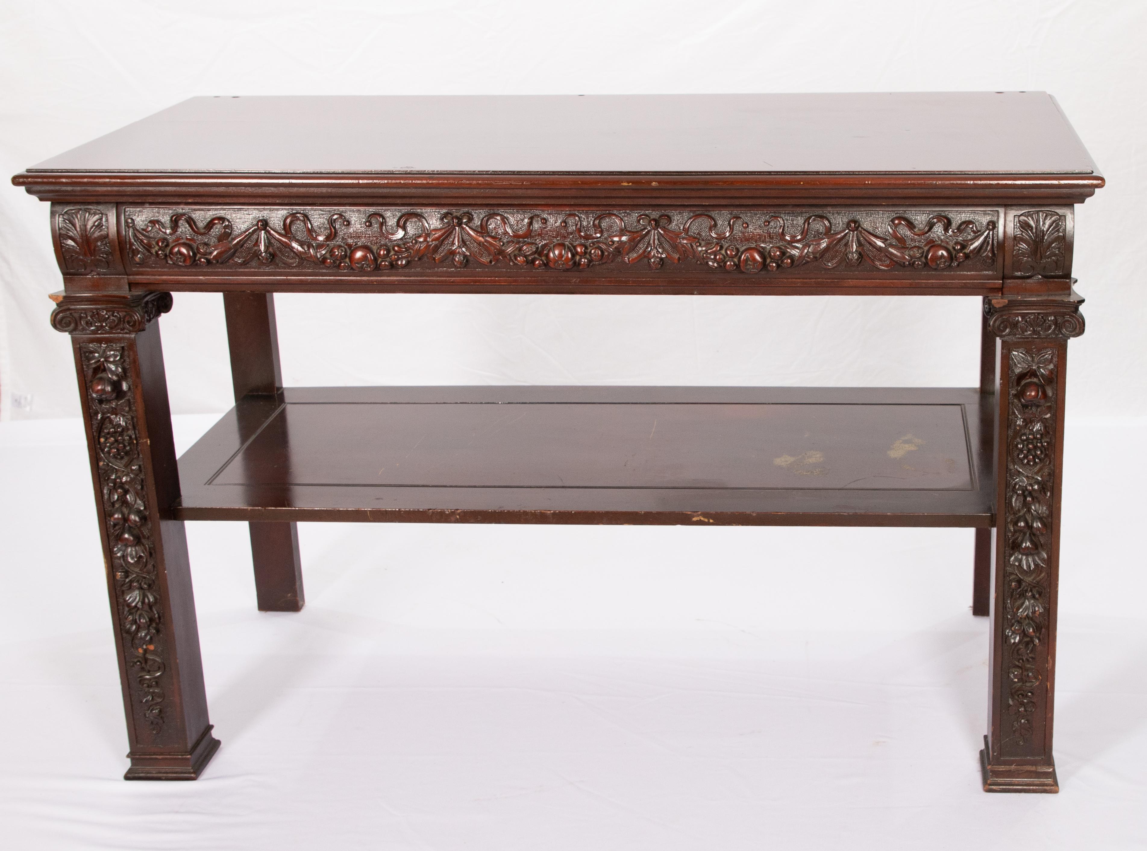 Offering this immaculate AJ Horner side server. Starting one four stately legs that are hand carved with foliate and floral detail. Rising to a center platform and then to the top. The server has the same floral detail around the skirt of the