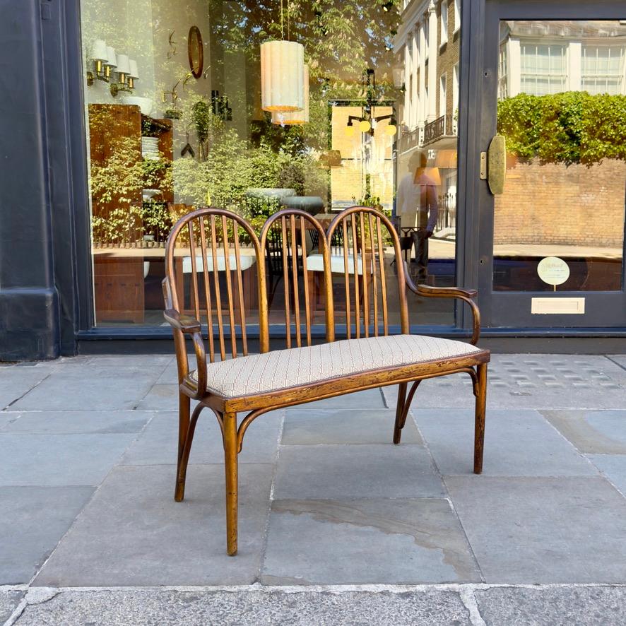 A rare and brilliantly proportioned Vienna Secession bentwood bench produced by the father and son duo, Jacob and Josef Kohn, circa 1910.
J. & J. Kohn of Vienna, Austria, was founded in 1849 as an interior design agency and a firm that made wooden