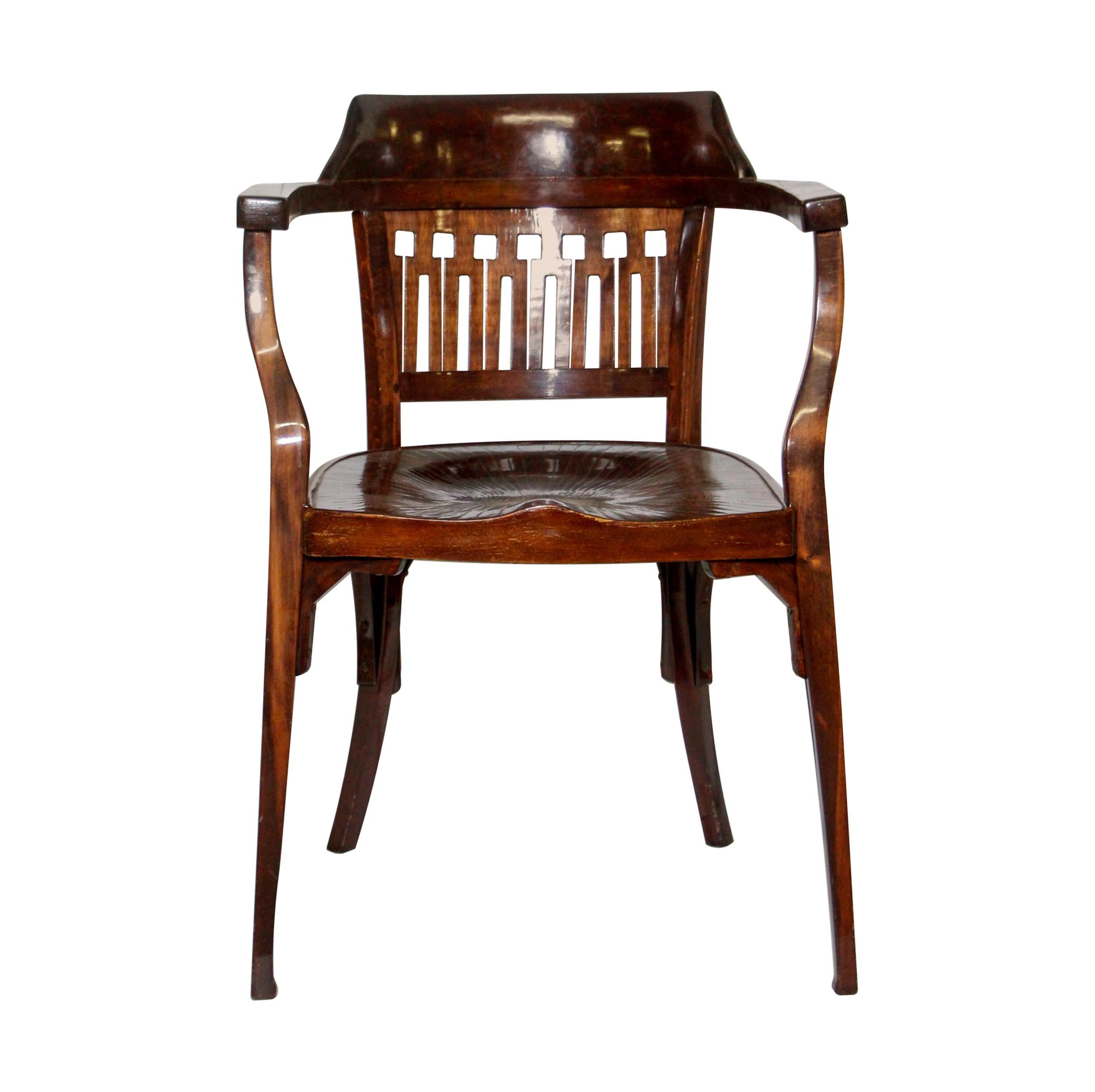 This secessionist Bauhaus bentwood armchair was designed by Otto Wagner and manufactured by Jacob & Josef Kohn.  J & J Kohn manufactured this chair from 1905-1915 in Vienna, Austria.  It has a nice dark-tone stain with a stylish curved back.  One