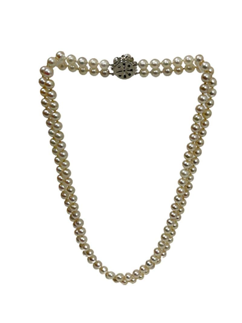 J. Kohle Pforzheim, German 14 Carat white gold with Akoya pearls necklace. 

132 Akoya pearls on double strand necklace with 14 Carat white gold closure with Diamond and 5 pearls and extra security lock.
Diamond 1/4 and pearls 8-10-12
The