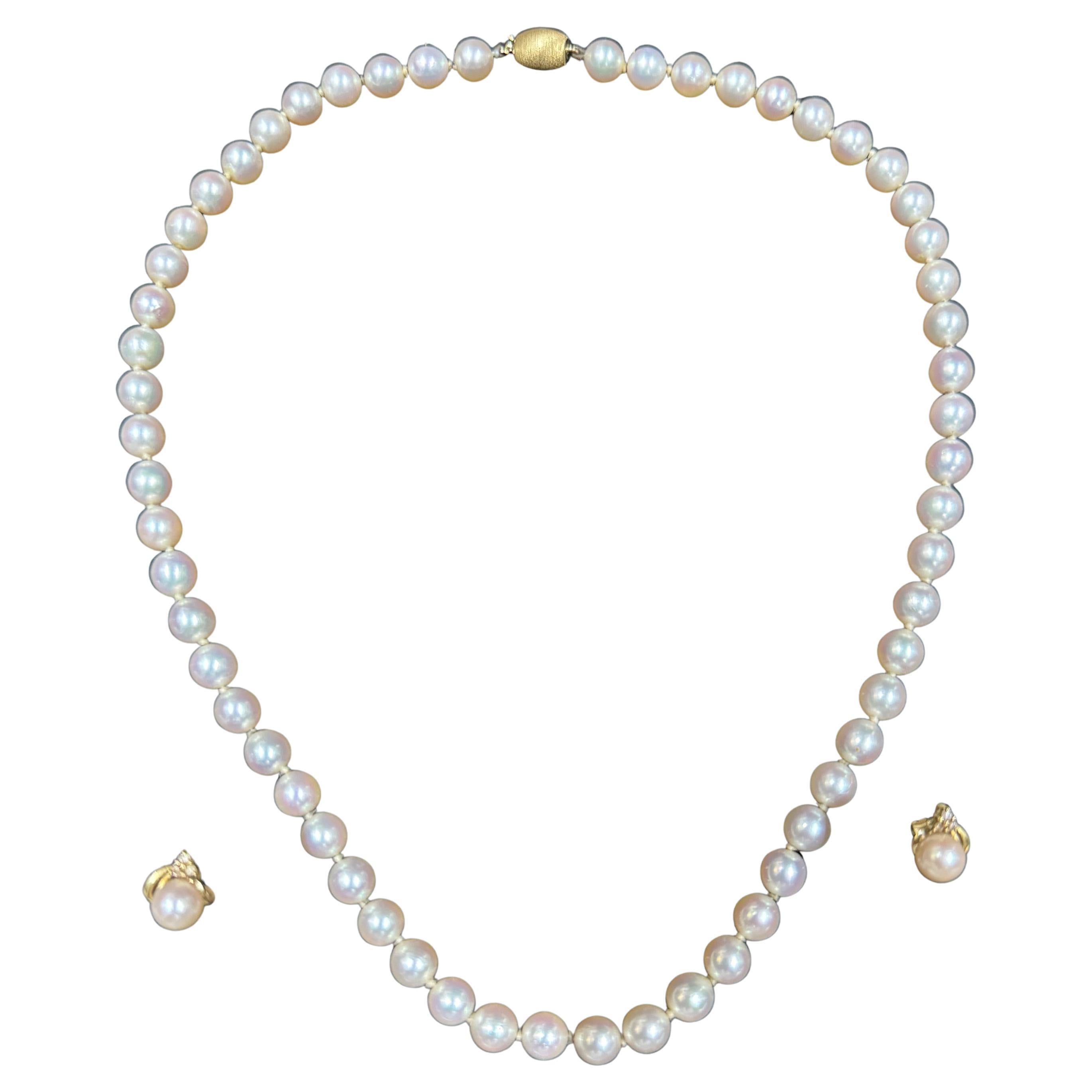 J KÖHLE(JKA)Pforzheim 18kt Gold Clasp Pearl Necklace with matching 18k earrings.