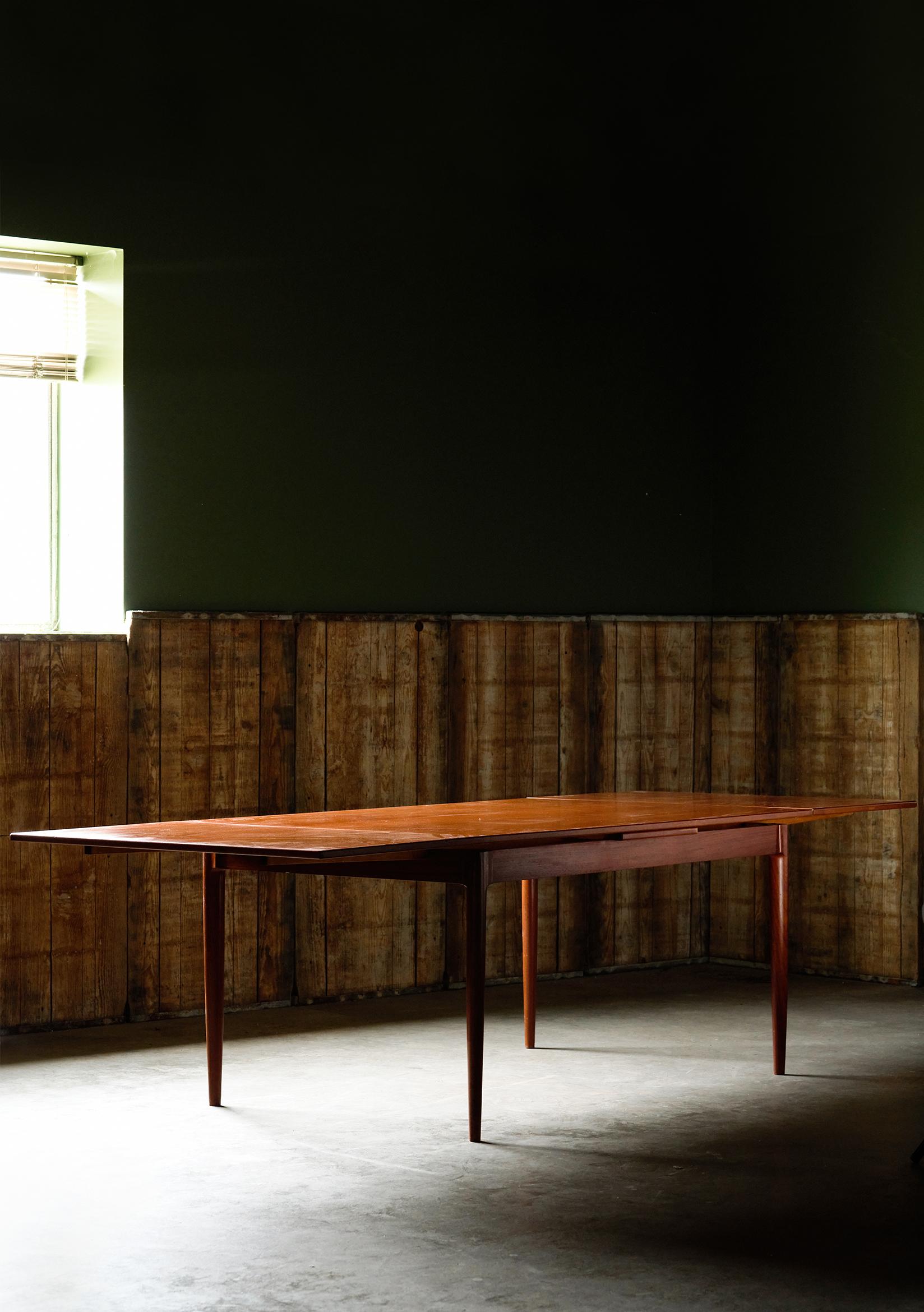 Beautiful teak mid century modern dining room table designed by Danish designer Niels O. Møller for J.L. Moller. Width when extended 105 inches. Excellent archetypical example of Danish Mid Century Modern Design/ Scandinavian Modern. 