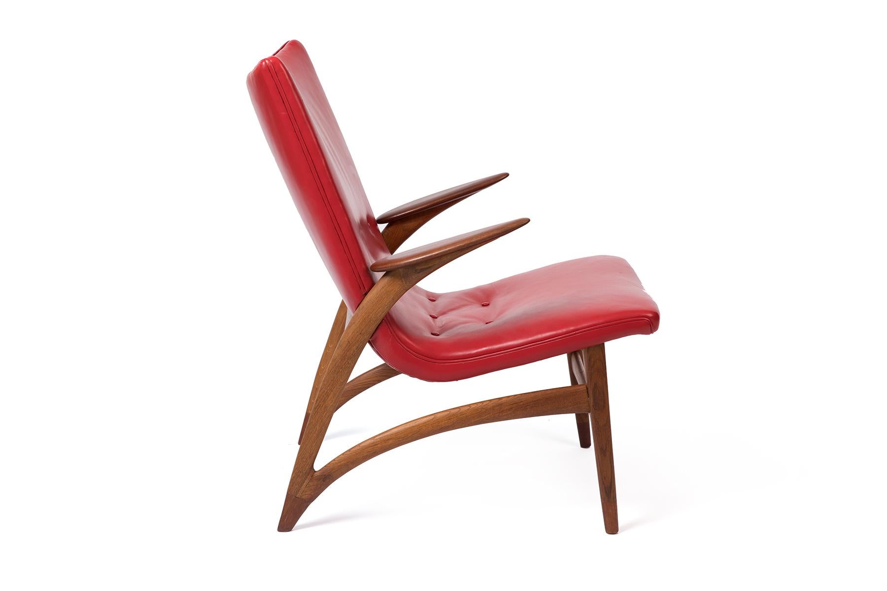 Sculpted teak and leather lounge chair by J L Möller circa late 1950s. This stunning and rare example is all original and seldom seen.