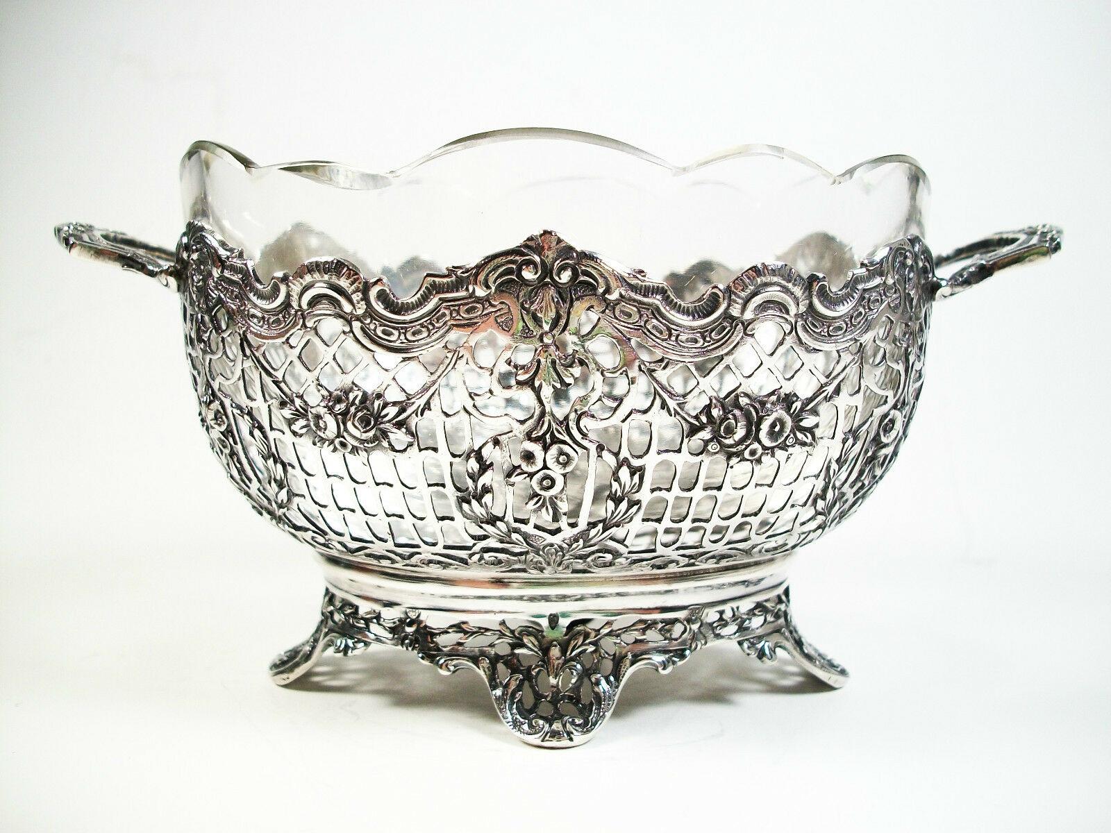 J. L. Schlingloff - Antique twin handled chased and reticulated silver basket - highest quality workmanship by a master Continental silversmith - original scalloped edge glass liner - hallmarked on the base - stamped 800 on the underside of each