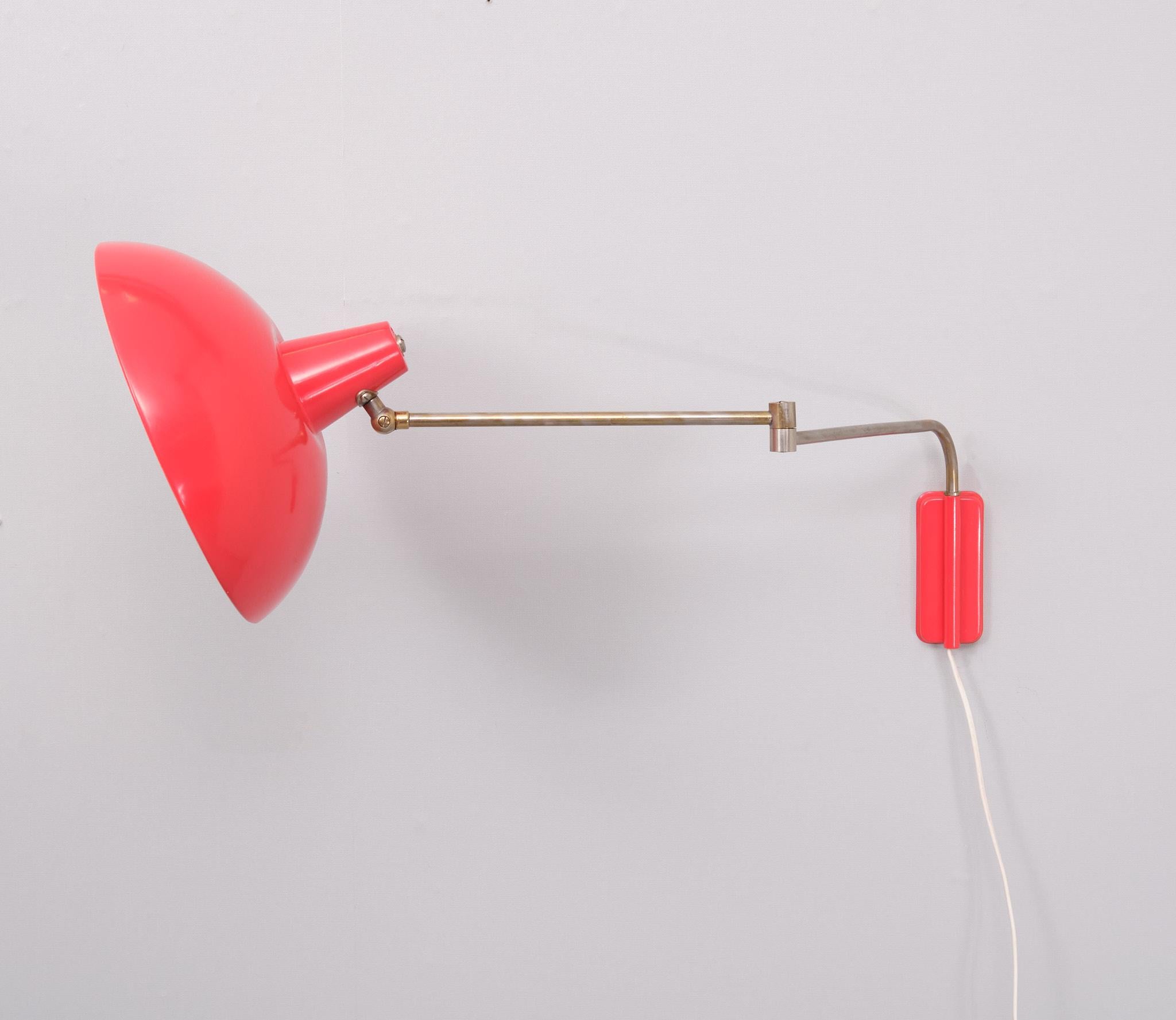 Very nice swing arm wall arm .Design by J M M Hoogervorst 
for Anvia  1960s Holland . Comes with a dimmer . One large E27 
bulb needed .Nice Orange Red color . good condition .