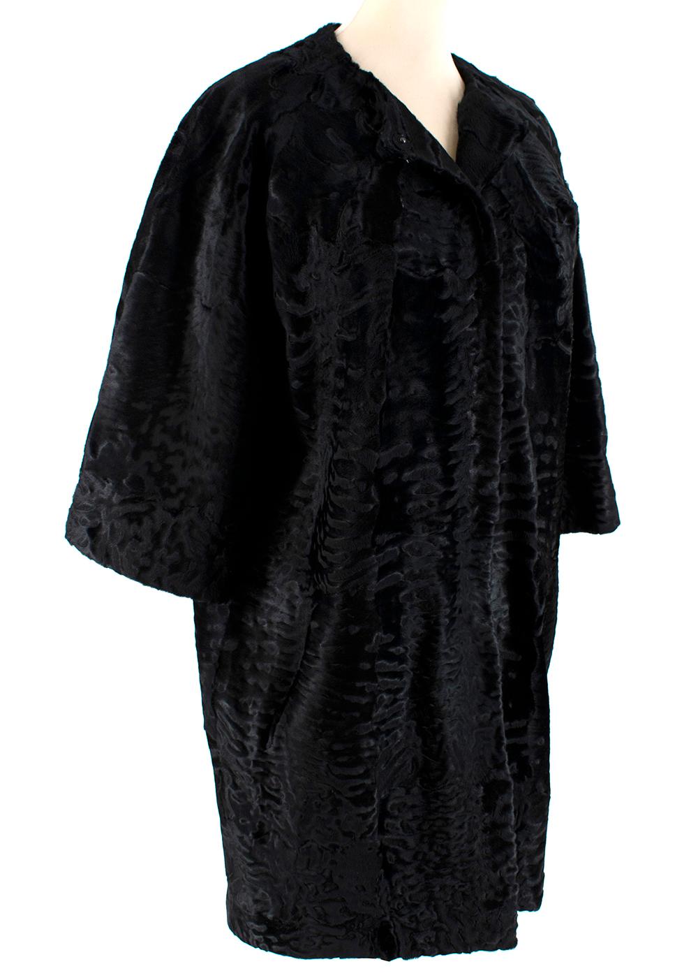 J Mendel Black Astrakhan Fur Collarless Coat

- Made of luxurious lustrous astrakhan 
- Soft beautiful texture 
- Classic cut 
- 3/4 Sleeves 
- Collarless 
- Pockets to the front 
- Snap fastening to the front 
- Luxurious silk lining 
- Neutral