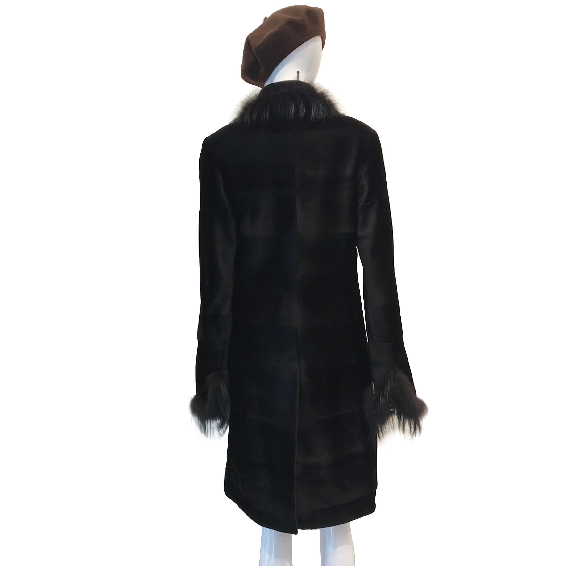 Fabulous Micro-sheared black mink  coat with black dyed  silver fox trim; fully  marked:
J.Mendel. Paris.  Fits size 4/6
