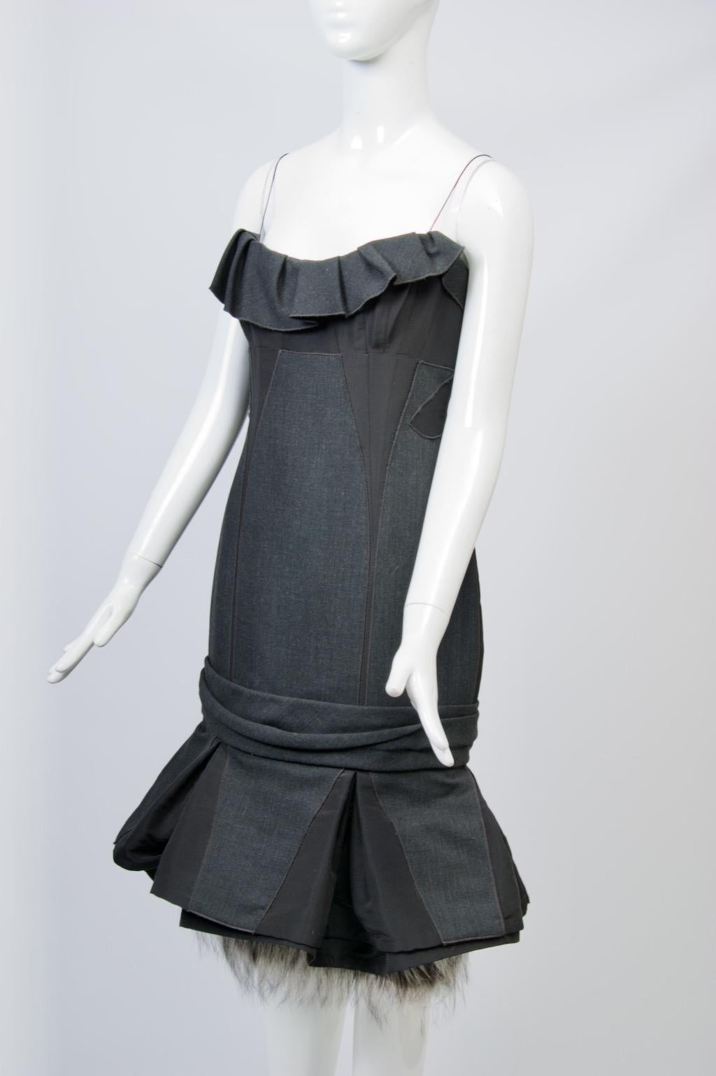 Unique cocktail dress by J. Mendel intricately constructed of charcoal wool and black faille and featuring a silver fox border which peeks out of the flounced hem. While the main body of the fitted dress is crafted of black faille, the front has