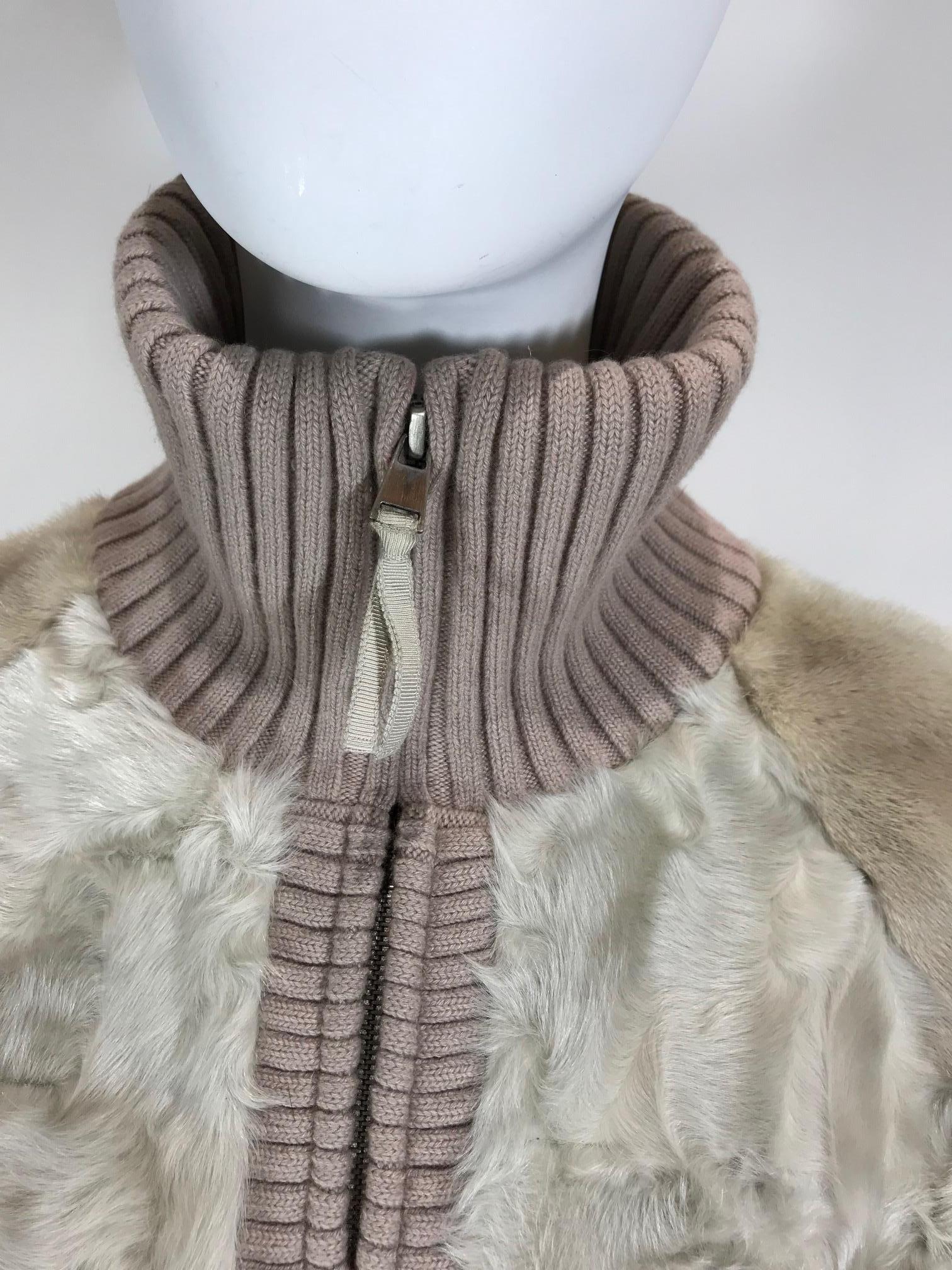 Creme and mauve persian lamb jacket. Zip closure at front. Rib knit trim. Mink fur sleeves. Dual pockets at hips. Size not listed, estimated from measurements. 