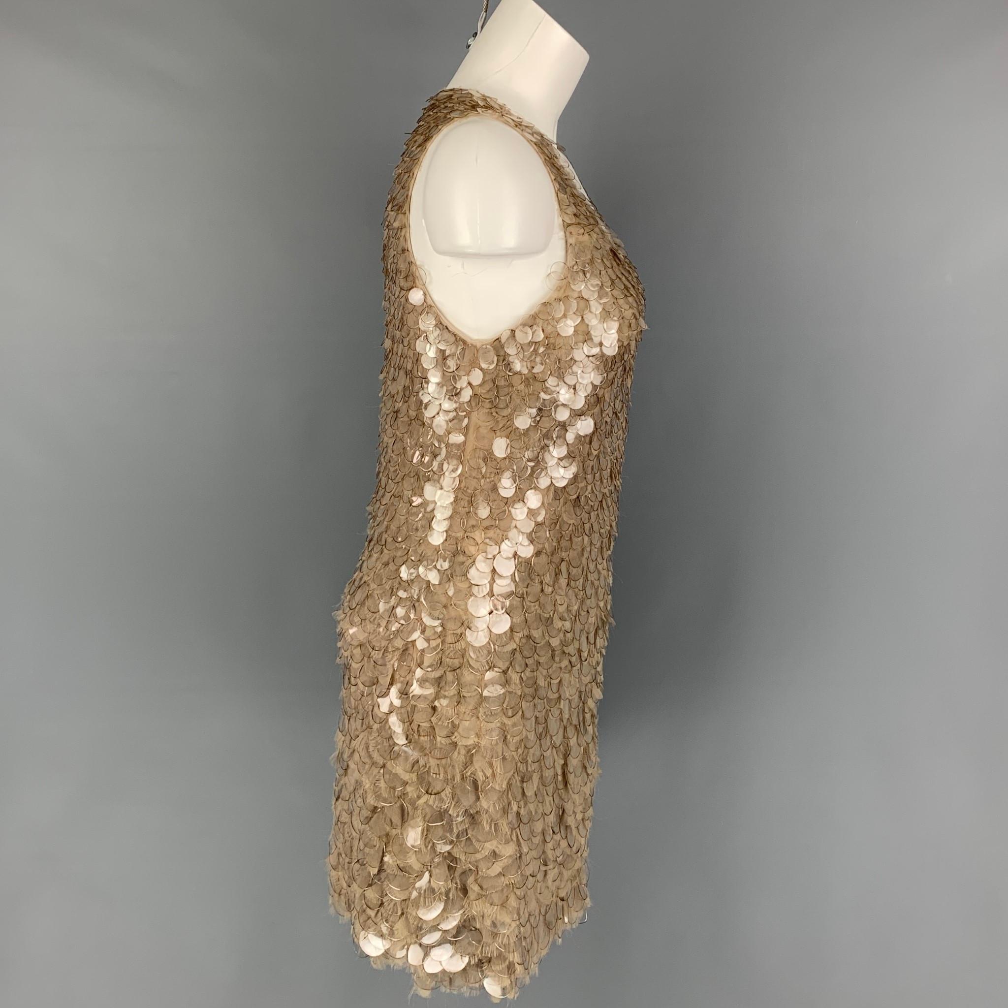 J. MENDEL dress comes in a taupe polyamide / silk with a pailette sequined design throughout featuring a shift style, sleeveless, and a side zipper closure. Made in USA. 

Very Good Pre-Owned Condition.
Marked: 8

Measurements:

Shoulder: 11.5