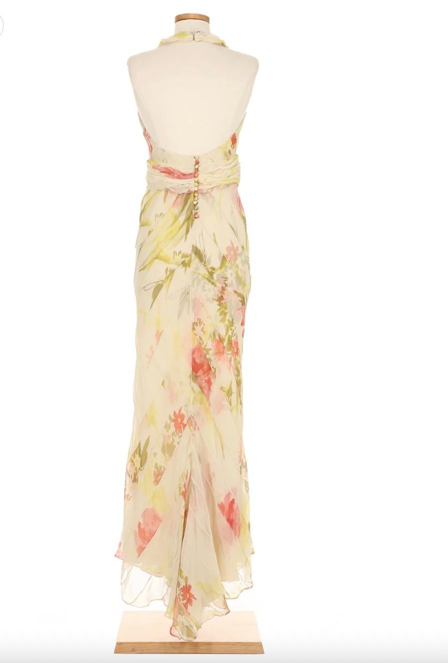 VINTAGE GRACE NY

A vision of ethereal romance, this J. Mendel Spring 2005 gown is a breathtaking display of delicate craftsmanship. The flowing silk chiffon features a soft floral print in pastel hues, evoking an air of effortless femininity.