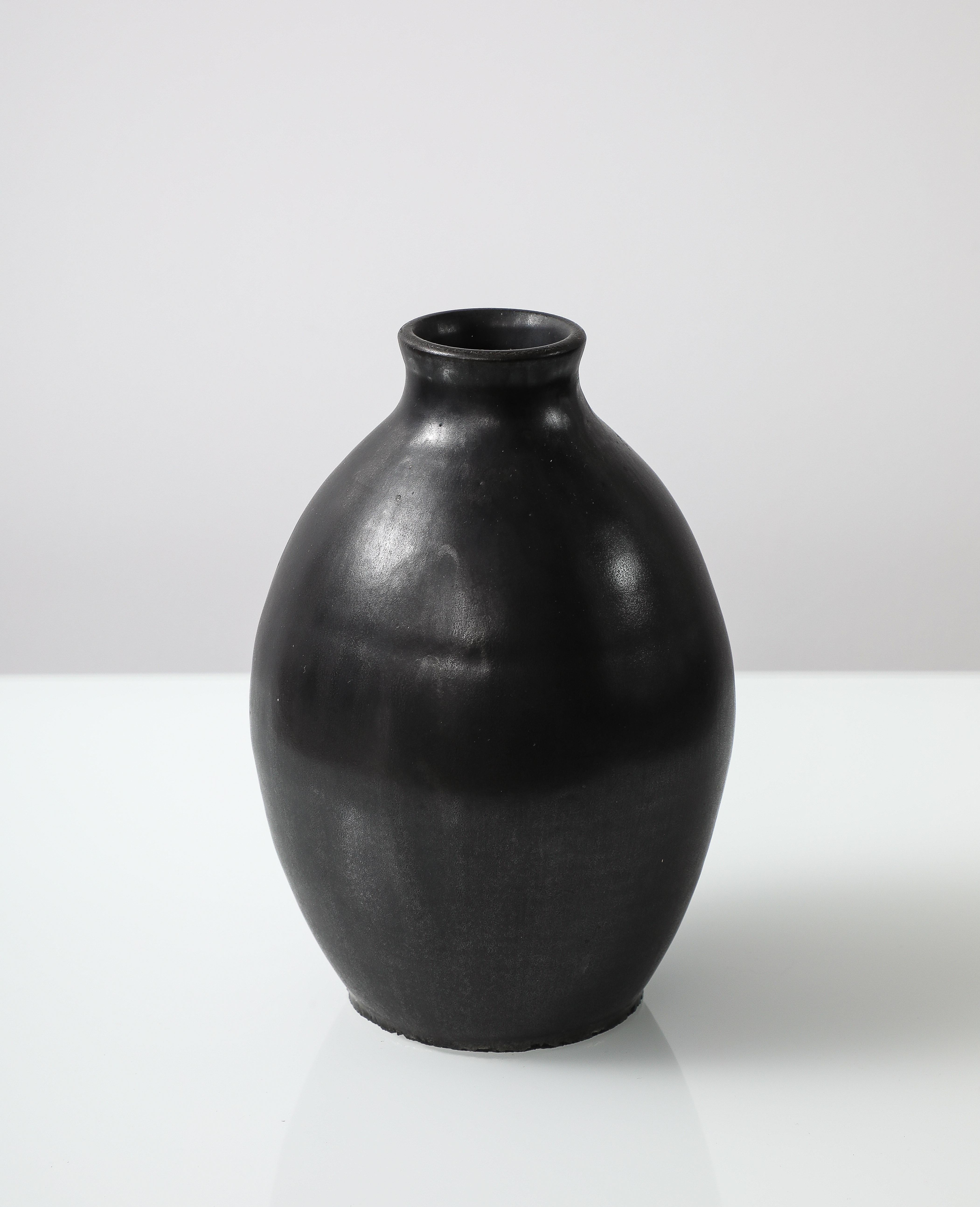 J. Mougin Black Vase, France, c. 1950

H: 7 Diam.: 4.33 in.