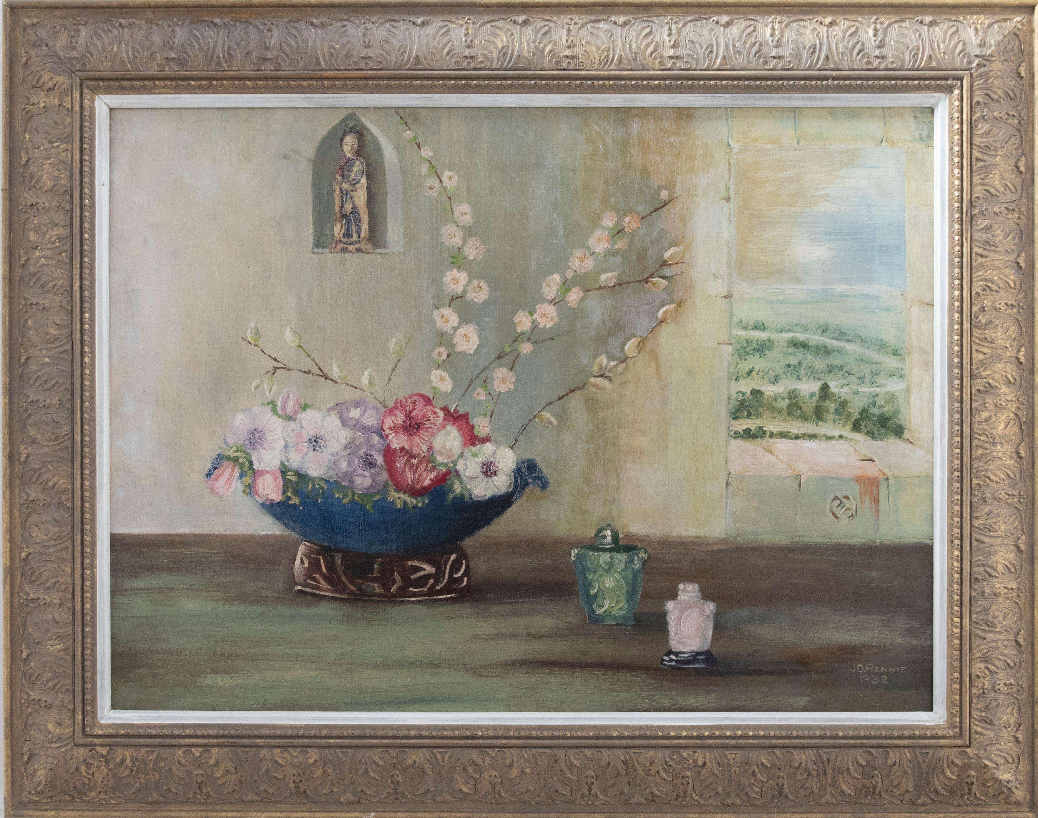 An oriental still life of blossom and flowers, arranged in a decorative vase with carved wood stand. To the right of the arrangement are two crystal vases in the colours pink and green. A geisha statue sits snug in a niche, next to a window with