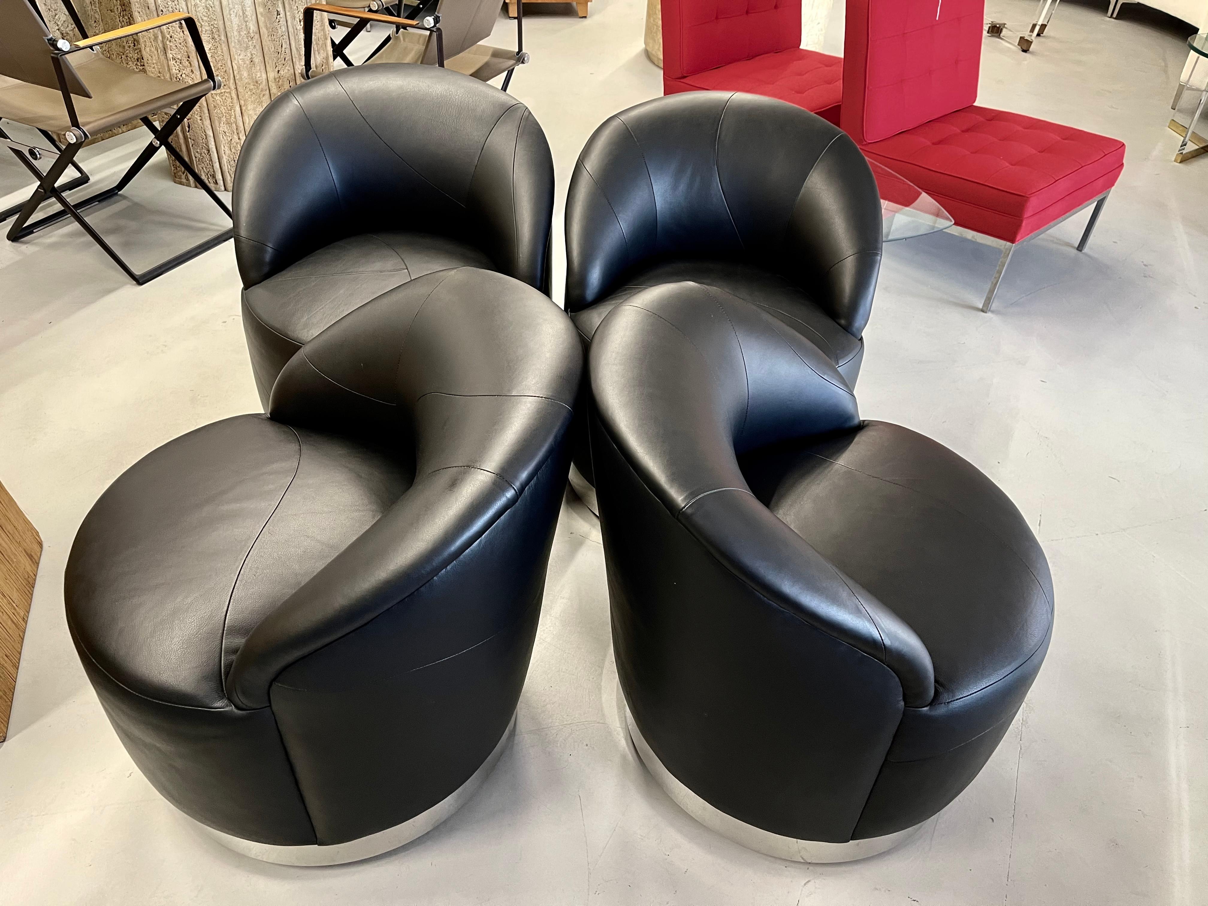 A beautiful set of 4 leather swivel chairs in Calfskin by J Robert Scott. Sally Sirkin Lewis used the softest and highest grade leather. They are wonderfully seamed together in an assymetric pattern. Each chair is slightly different in pattern. They
