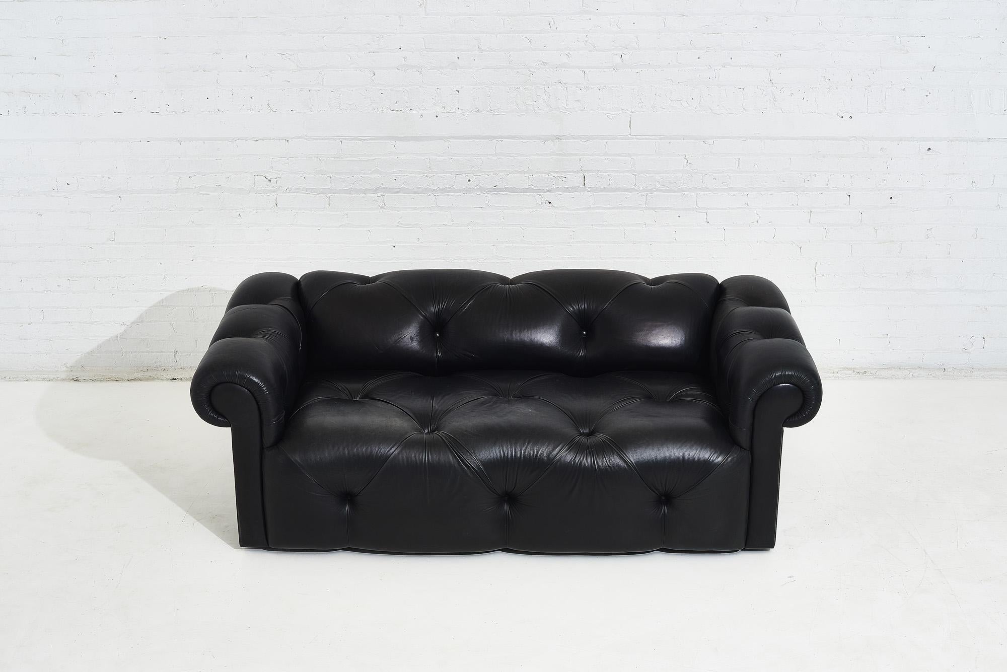 Black leather chesterfield tufted sofa by J Robert Scott. Incredibly soft leather with over size tufts. Original leather is in great condition, with fading across back that truly adds to its beauty.