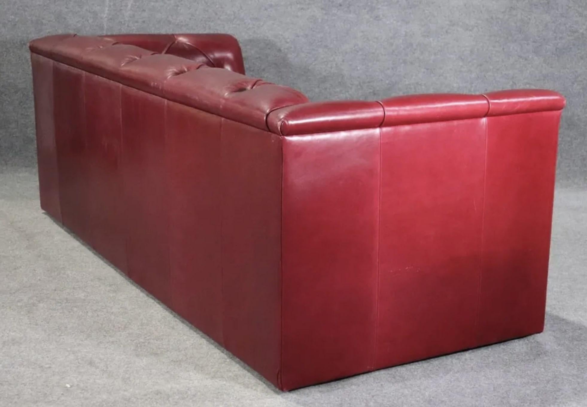 Tufted sofa by J. Robert Scott in maroon red leather. Seat goes down to the floor for a low profile.
Please confirm location NY or NJ