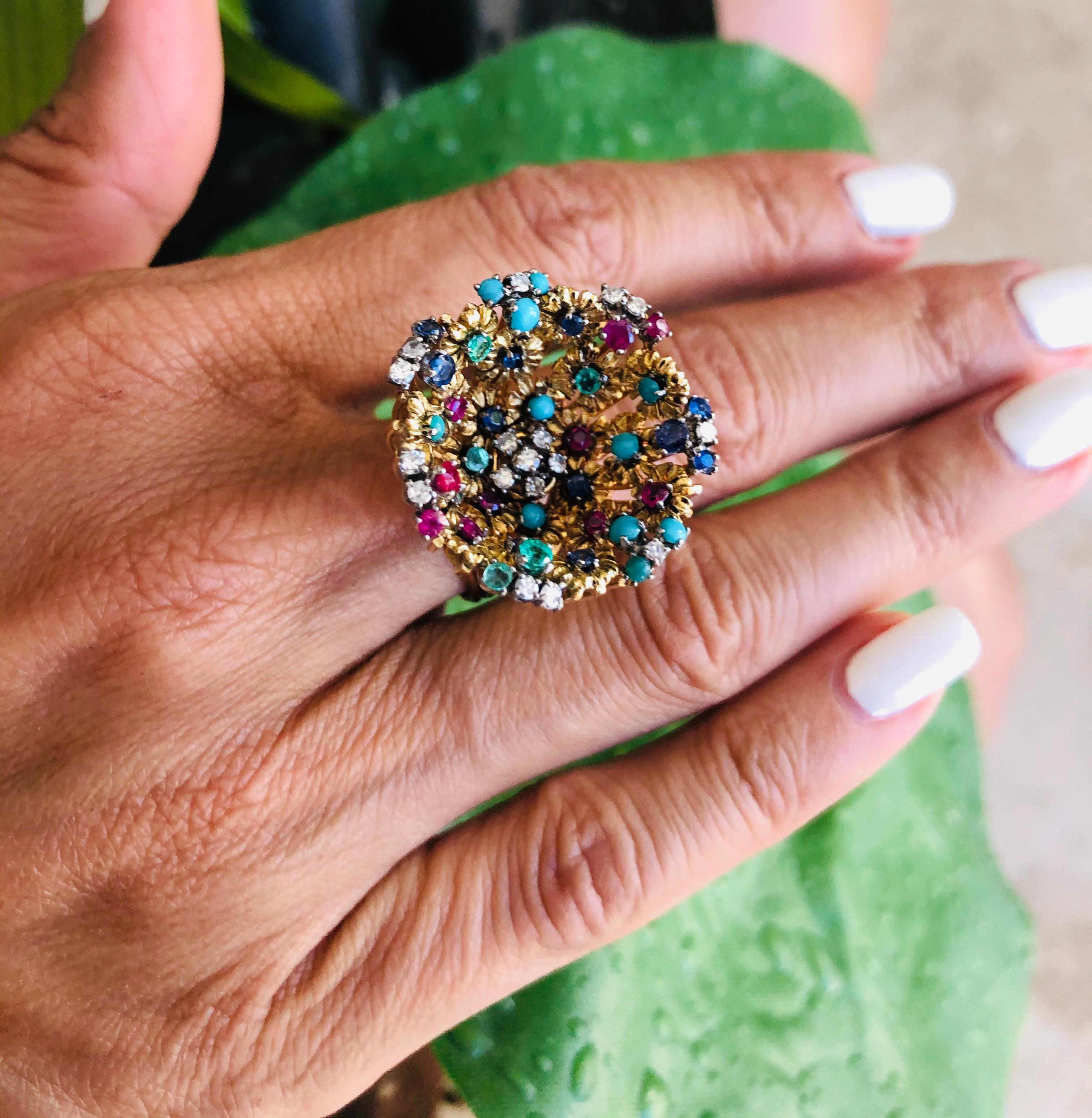 Offered here is a unique J Rossi 18kt gold ring with multi color gems and diamonds. The ring looks like a flower garden in a basket. The ring is marked J Rossi 18k. The ring weighs 13.6 grams. The ring is a size 5.5, that can be sized. The ring has
