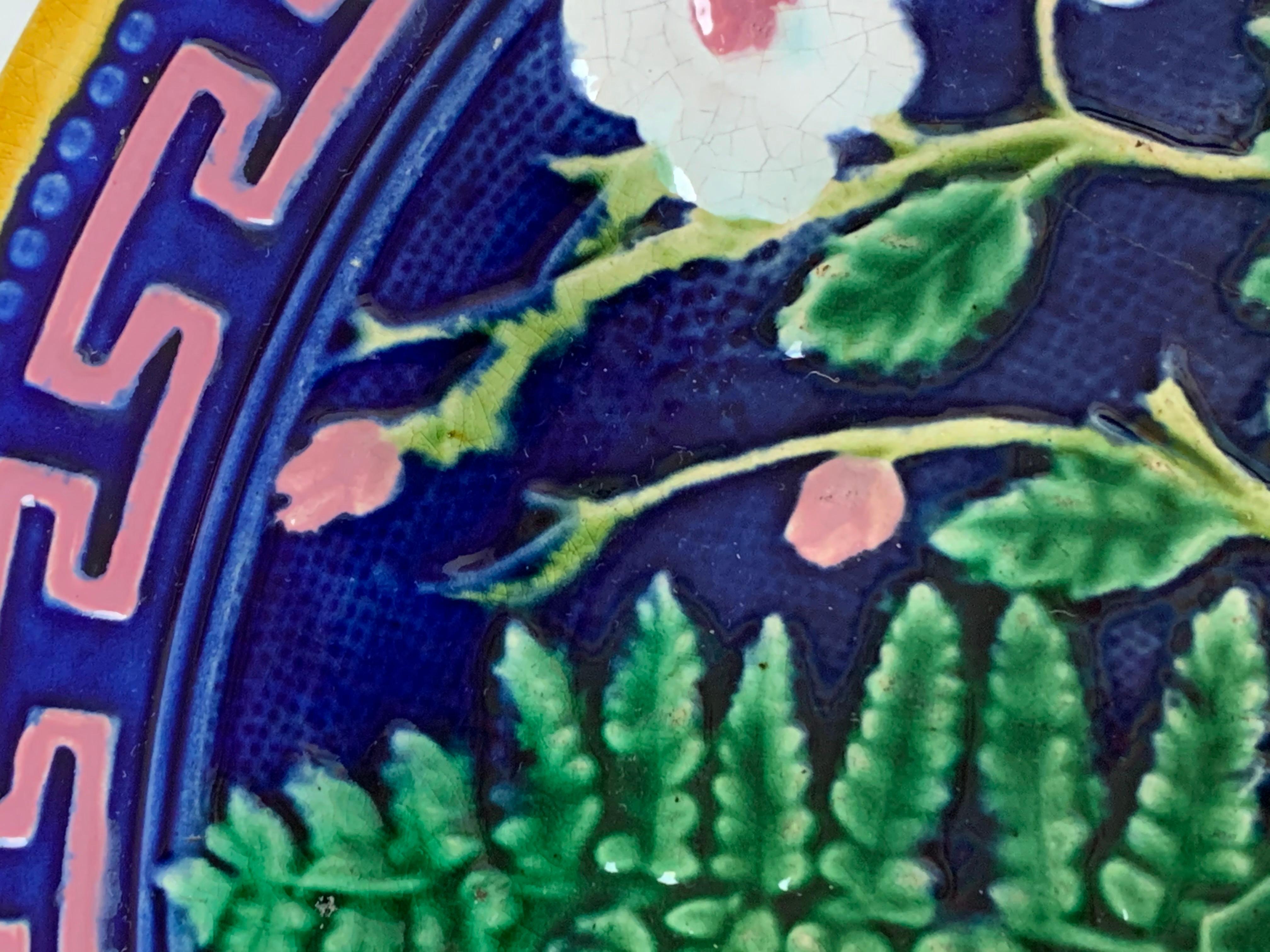 J. Roth London Majolica Taza, with Greek key boarder in pink on cobalt blue, with green leaf and ferns and wild roses, English, circa 1880, on a footed circular base, incised monogram to reverse, 'JRL' for John Roth, London.
For over 28 years we