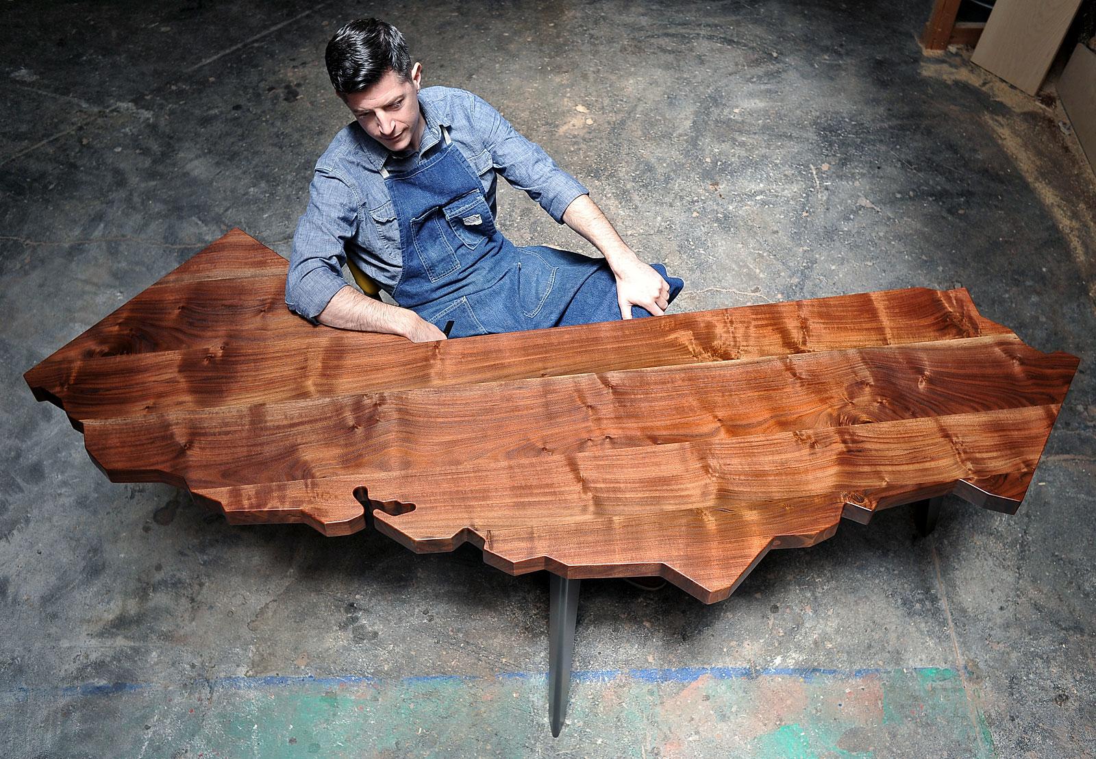 Since 2007, J. Rusten Furniture Studio has been creating the original and now familiar California Series of tables and desks. Carefully cut into the iconic shape of California, each piece is crafted from locally salvaged Claro walnut and features