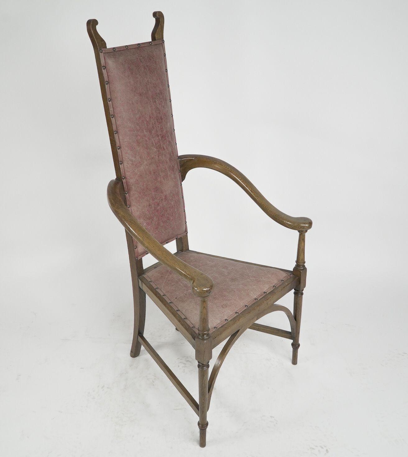 Arts and Crafts J S Henry. An ash Arts & Crafts armchair with an elongated back & curled ears For Sale