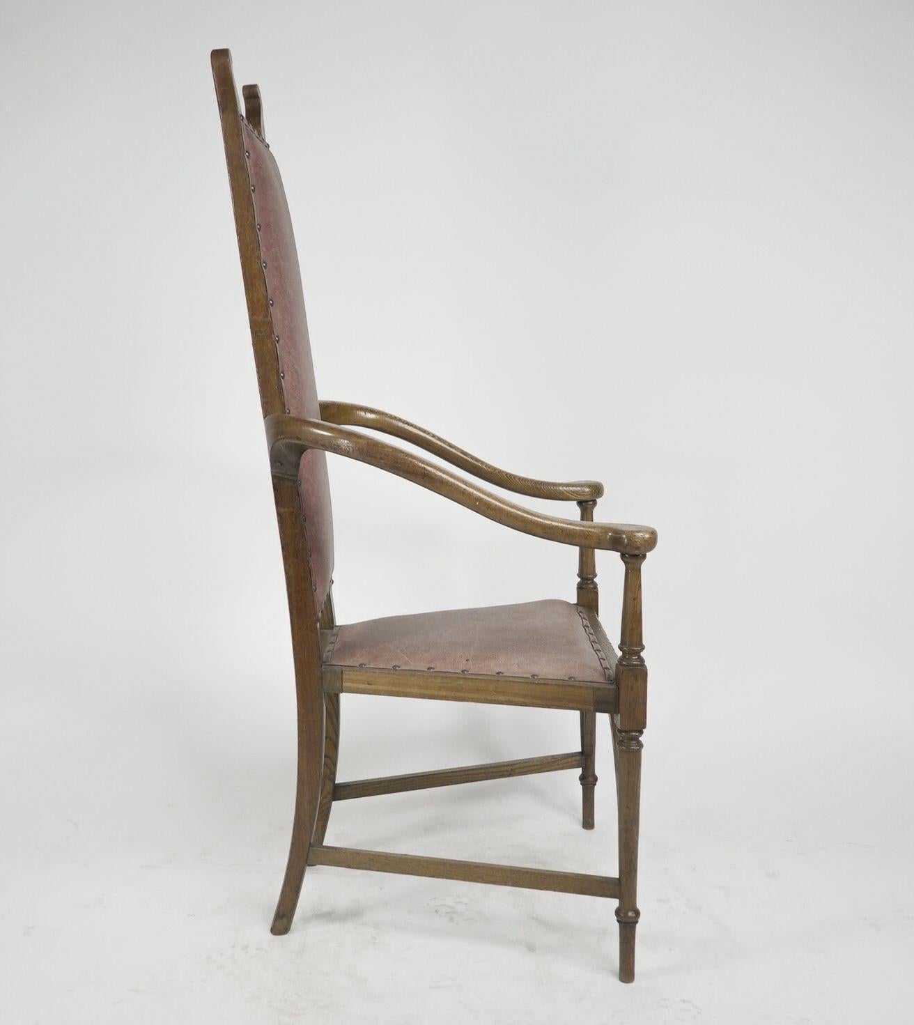 English J S Henry. An ash Arts & Crafts armchair with an elongated back & curled ears For Sale