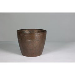 J S & Sons. A pair of Arts and Crafts copper planter with floral decoration