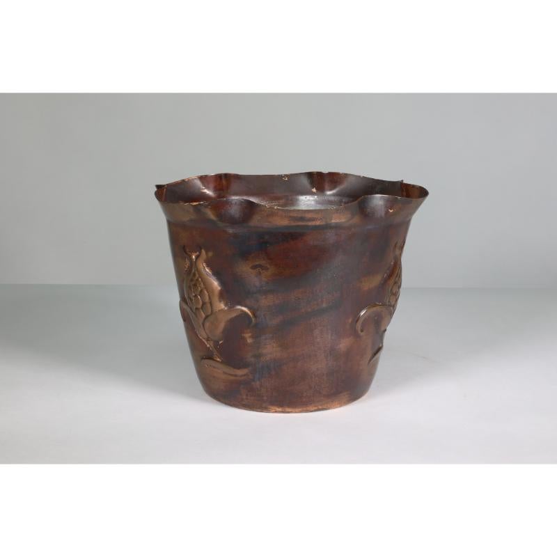 Joseph Sankey and Sons. A large Arts and Crafts heavy copper planter decorated with a  flower head in seed. Stamped J S & S. Made in England. Solid Brass. RD 403903 for Circa 1903.
