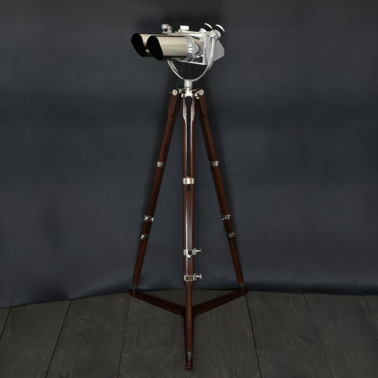 A superb 10 x 80 (10 power magnification and 80 mm objective lenses) double telescope binocular by Joseph Schneider of Germany with 45° inclined oculars and integral filters. This model of binocular was originally designed by Emil Busch in 1935,