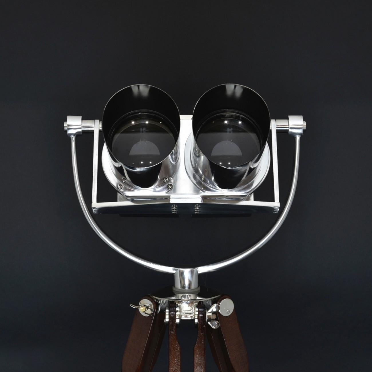 A superb 10 x 80 (10 power magnification and 80 mm objective lenses) double telescope binocular by Joseph Schneider of Germany with 45° inclined oculars and integral filters. This model of binocular was originally designed by Emil Busch in 1935,