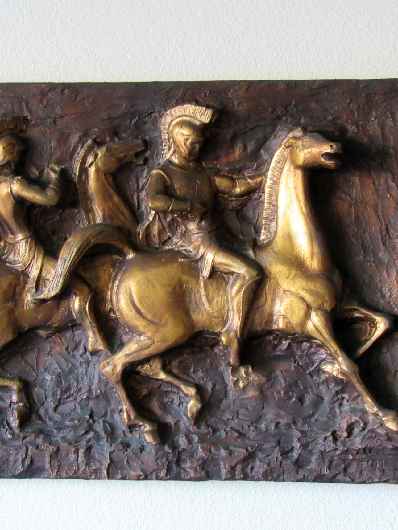 J. Segura Roman Soldiers on Horses cast resin wall sculpture, 1960s. Made by J. Segura, a Miami company, this wall mount relief depicts Roman soldiers on horseback and is made in cast resin. Original hanging tag on back, in very good condition.