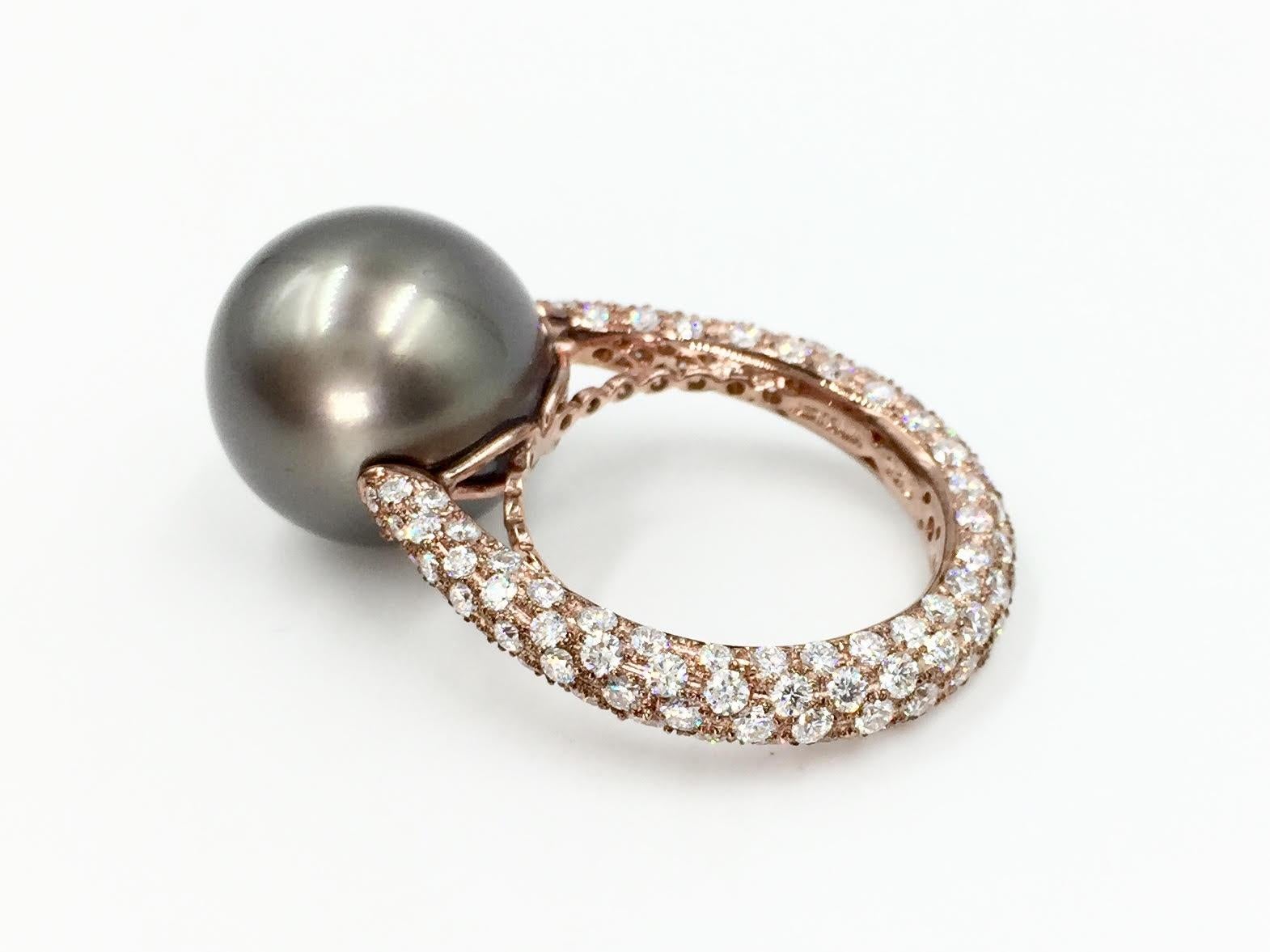 Exceptional quality from high jewelry designer, J. Stella. A total weight of 2.29 carats of round brilliant diamonds are perfectly pavé set on all three sides of the shank of the ring. The 14mm natural Tahitian pearl has an unexpected yet stunning