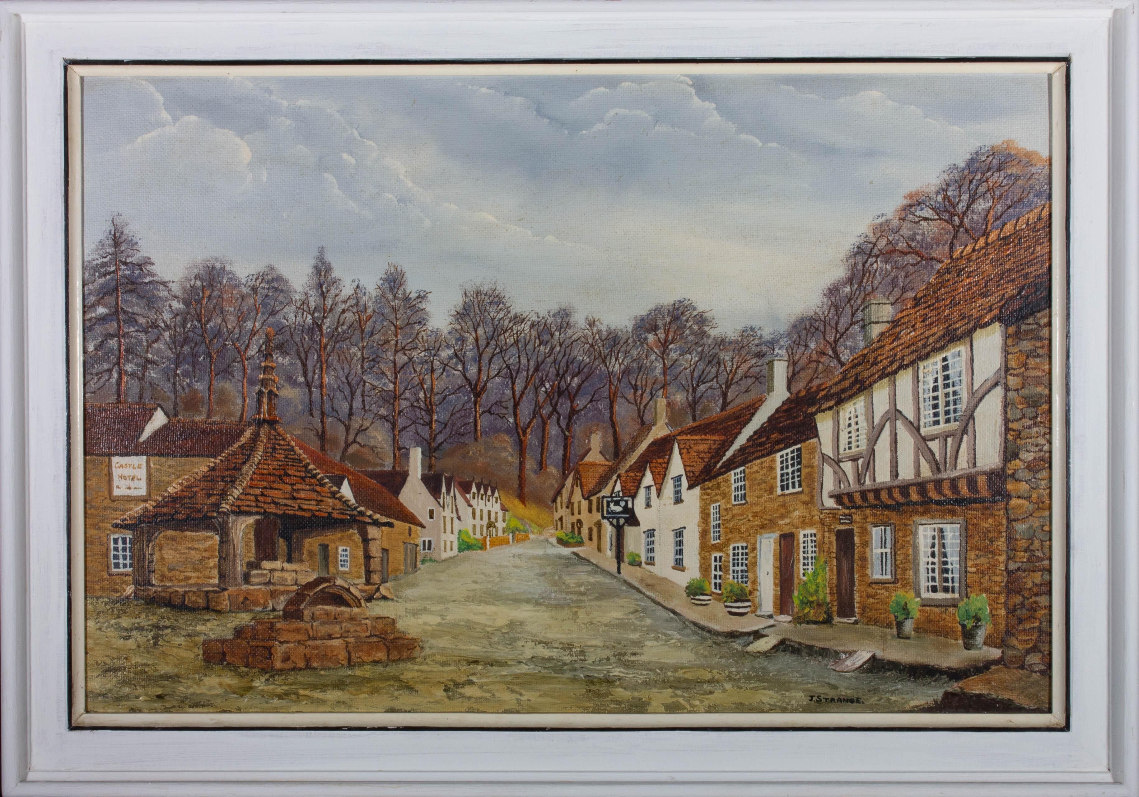 An attractive oil painting by J. Strange, depicting a view in Castle Combe, Wiltshire. Signed to the lower right-hand corner. The title is inscribed on the reverse. Presented in a white wooden frame with an inner detail in black. On board.
