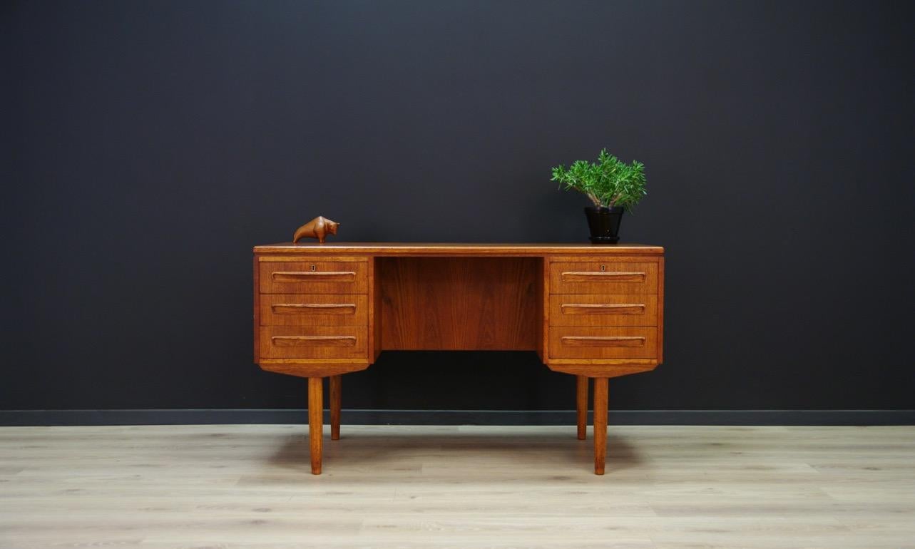 Original desk from the 1960s-1970s, Danish design. Minimalist form designed by the leading Danish designer J.Svenstrup. Finished with teak veneer. Practical front with six drawers, a bookshelf, and a bar at the back. No key in the set. Preserved in