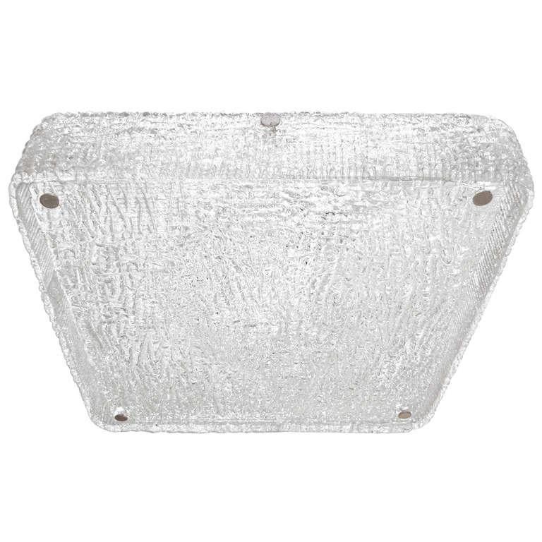 A square textured glass ceiling fixture consisting of a glass square plate and one continuous molded piece of glass that make up the perimeter of the fixture both mounted on a metal frame with polished nickel hardware by J. T. Kalmar, Austrian,