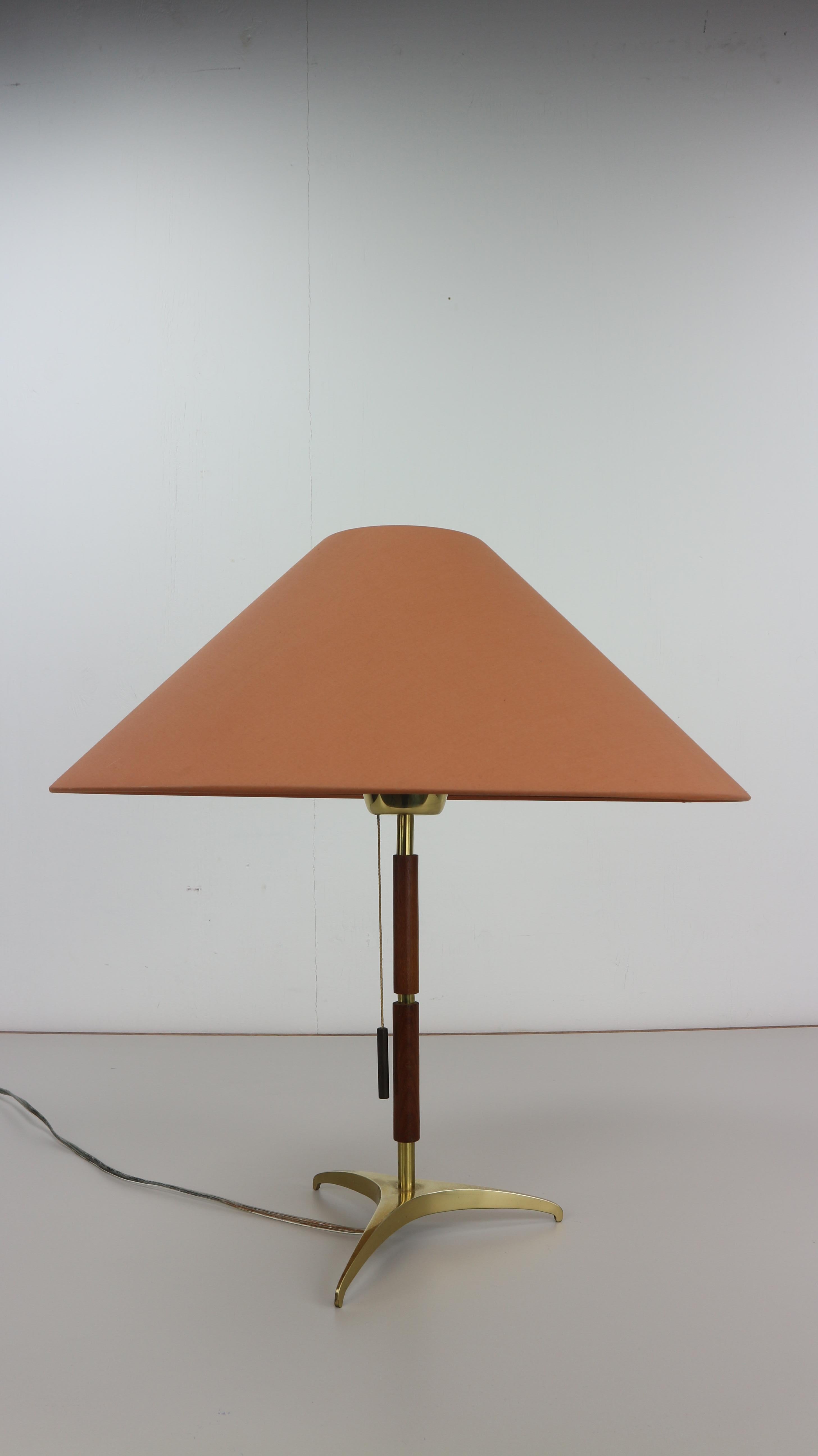 J. T. Kalmar table lamp manufactured in Austria in the 1950s by Werksentwurf.
Base is made of solid brass with a rosewood stem and brass pull switch.
  