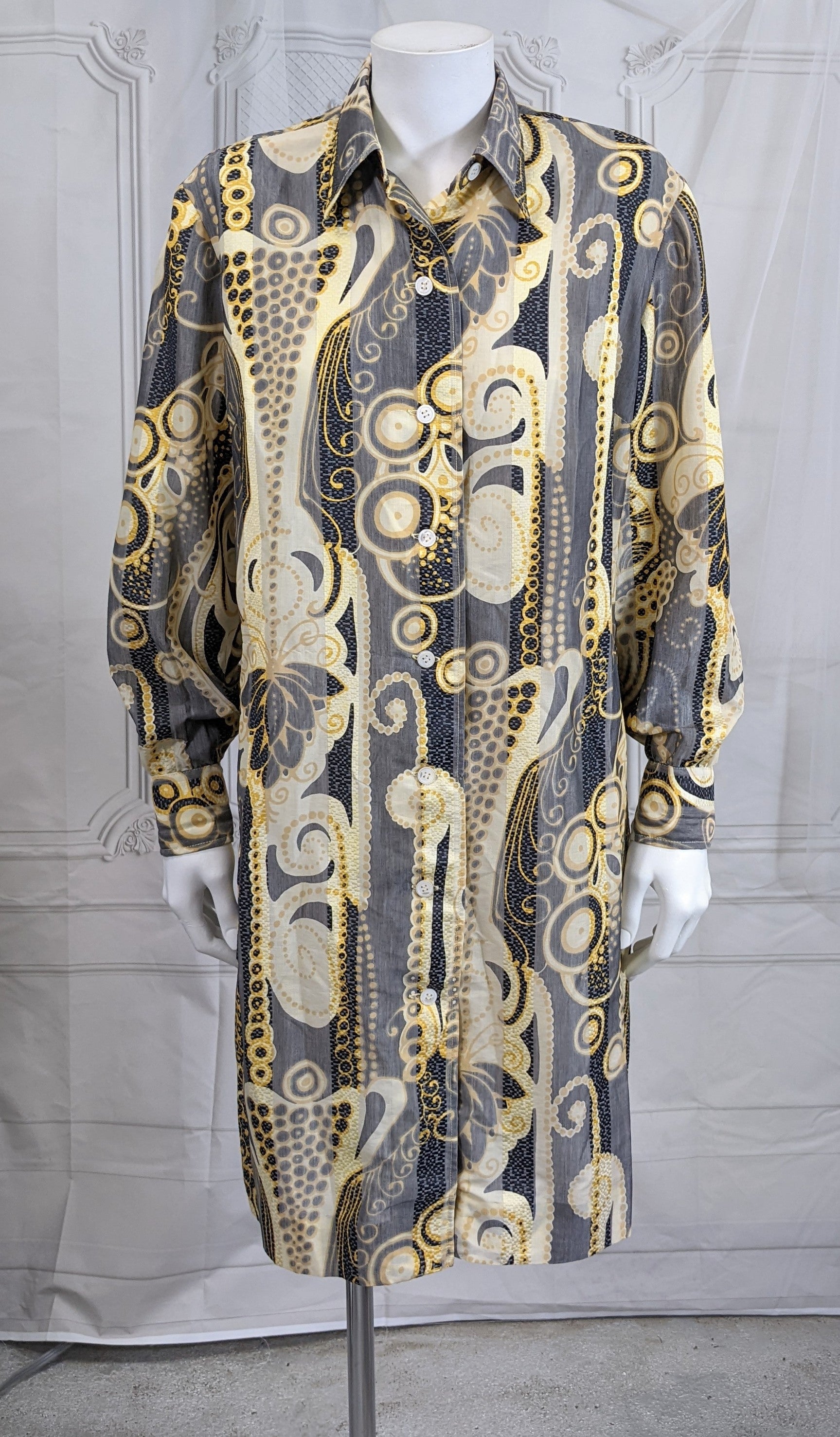 J. Tiktiner Silk Blend Shirtwaist in abstract organza silk blend fabric. Abstract Klimt like patterns overlaid over a wide striped which is somewhat sheer, needs a liner/slip. Good Condition. Mother of pearl buttons. 
Vintage size 14, similar to
