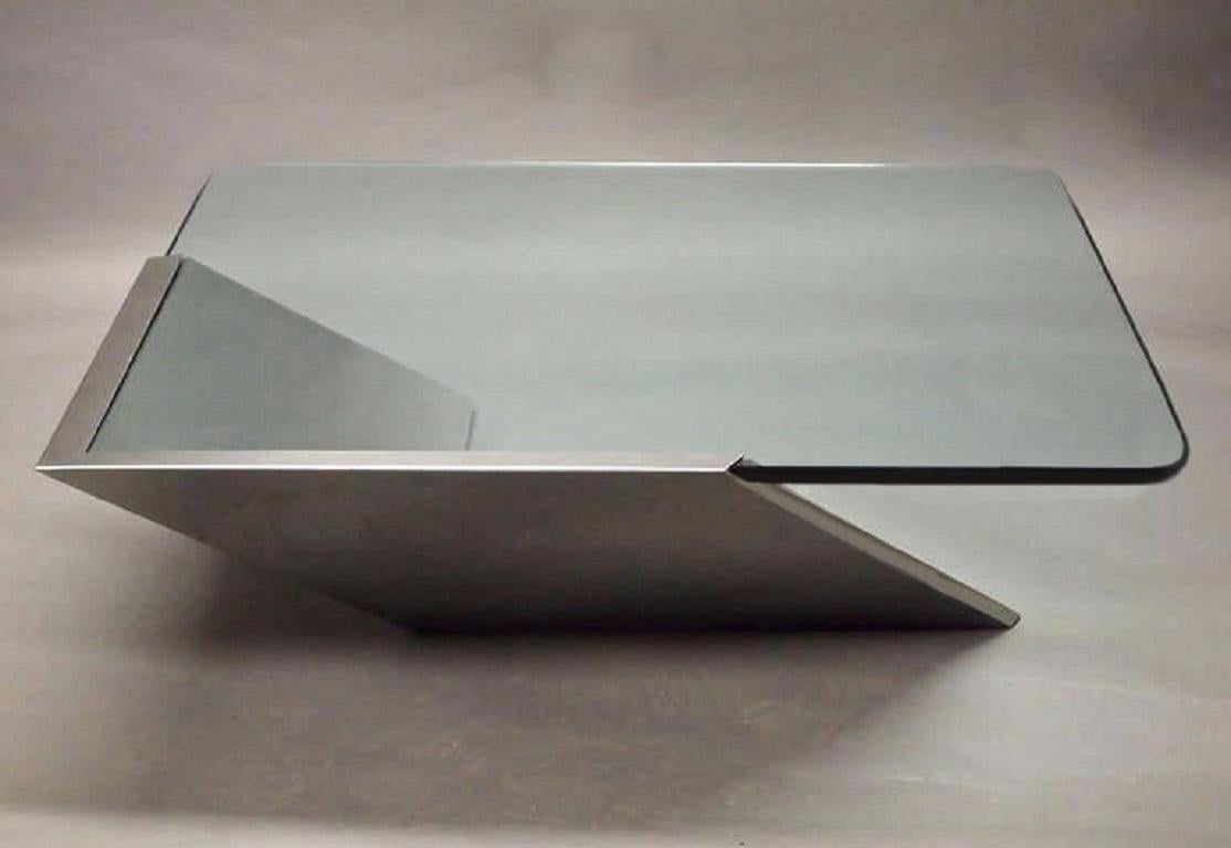 The original SMT table by J. Wade Beam for Brueton was designed with a polished stainless steel base and 1/2