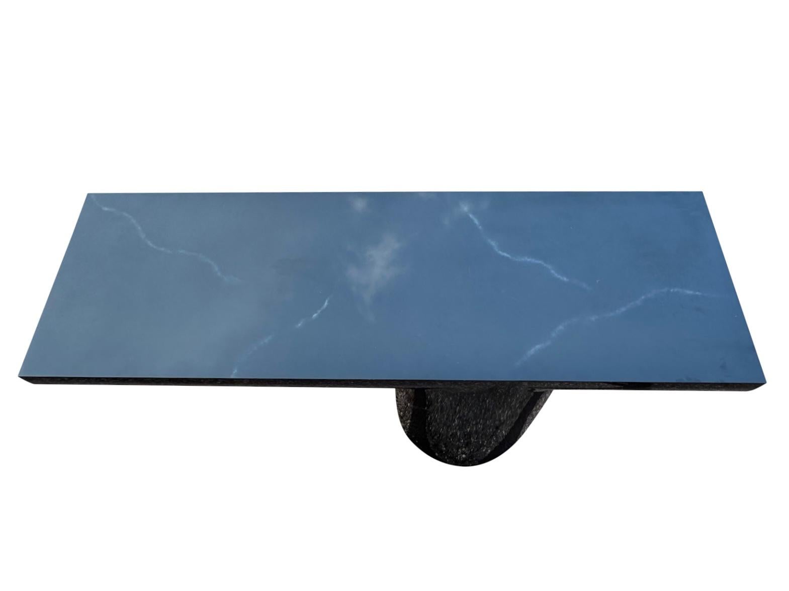Amazing console table with a lacquer faux black and white marble finish table designed by J. Wade Beam