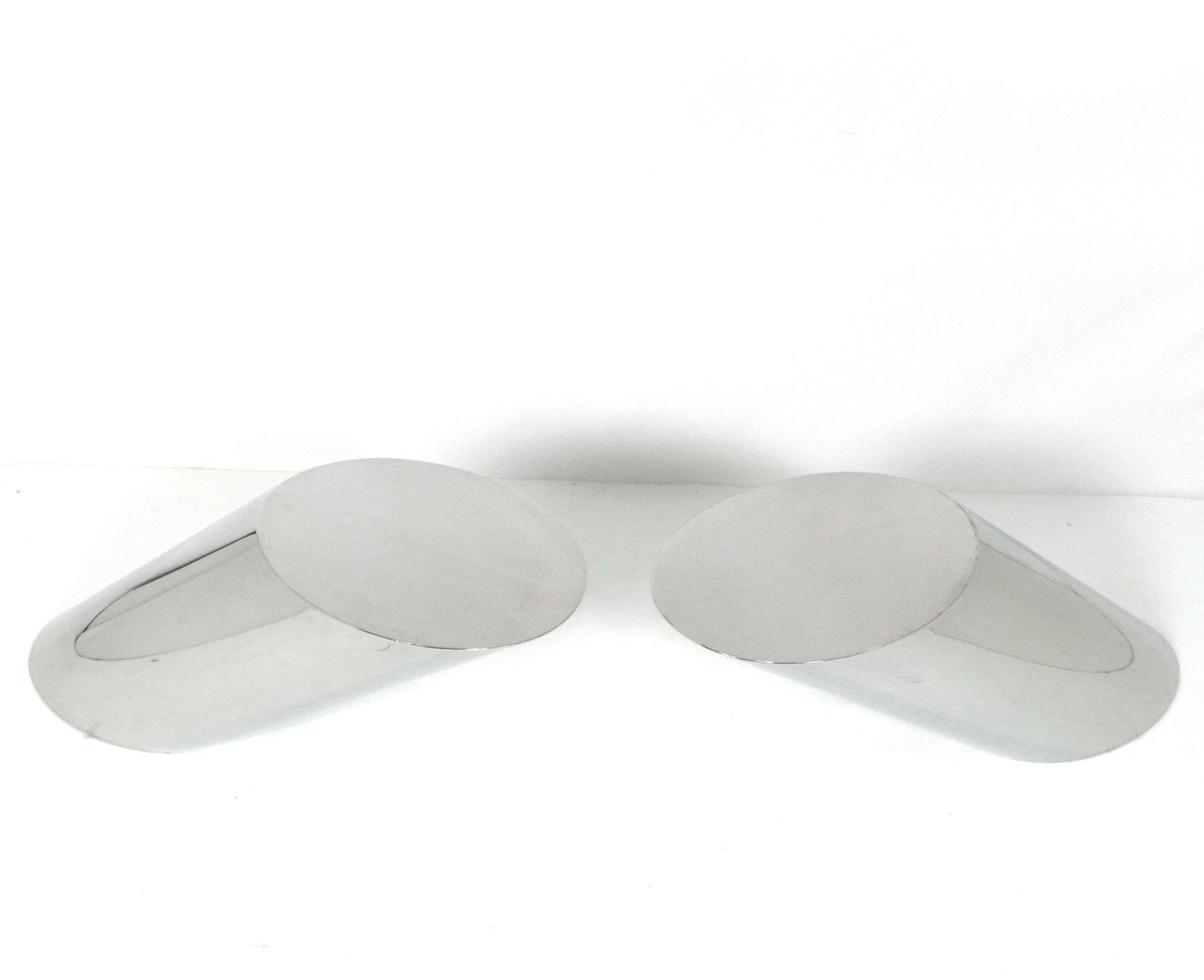 Sculptural Pair of “Zephyr” Model End Tables, designed by J. Wade Beam for Brueton, American, circa 1980s. They are sleek and shiny and look like chrome, but are believed to be polished steel. They are a versatile size, and can be used as end or