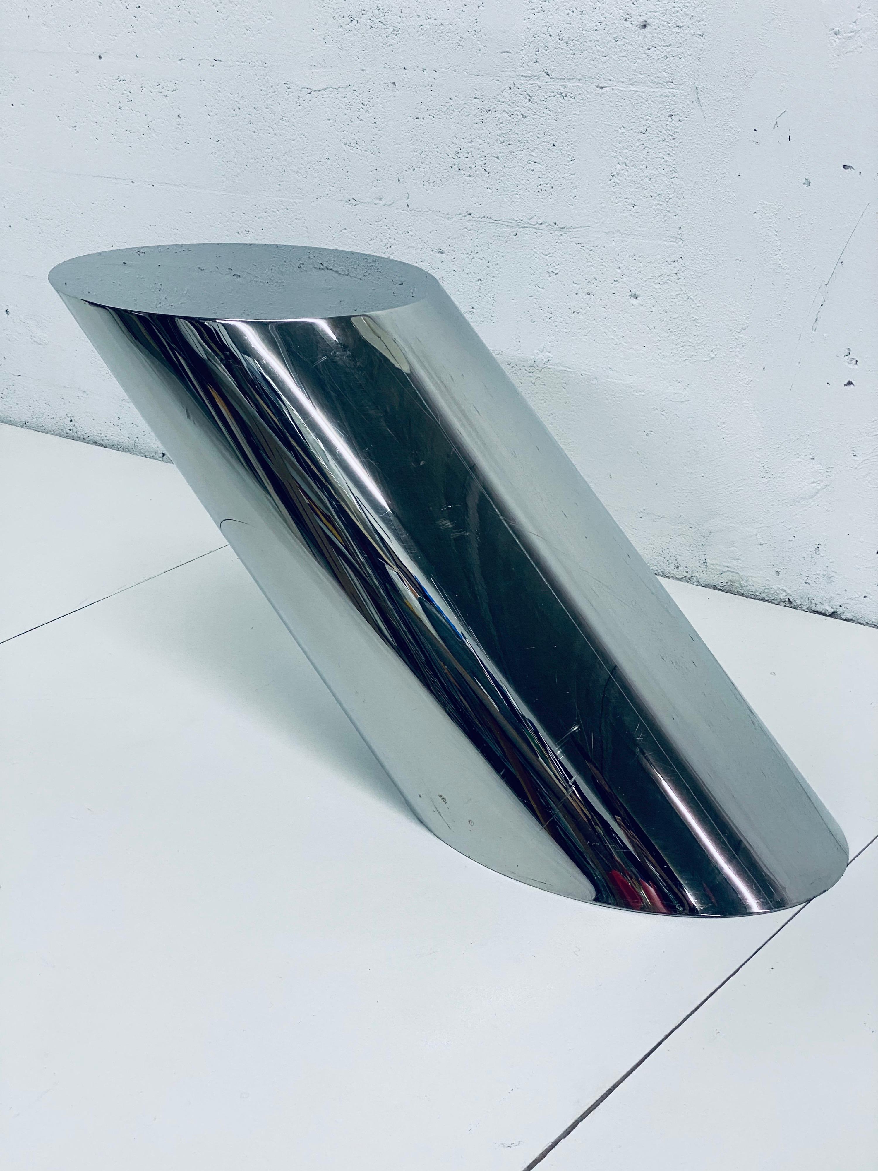 Original condition polished steel cantilever table designed by J Wade Beam and manufactured by Brueton circa 1970s. The base is weighted and is angled at 45 degrees. Use as side, end or drinks table.